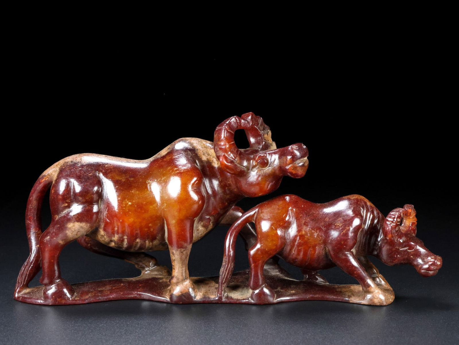 A Exquisite Hotan Jade Buffalo Ornament: A Exquisite Hotan Jade Buffalo Ornament,Han Dynasty, China,Size:9.1inx3.9inx2.4in,Weight:823g 和田玉牛摆件,中国汉代