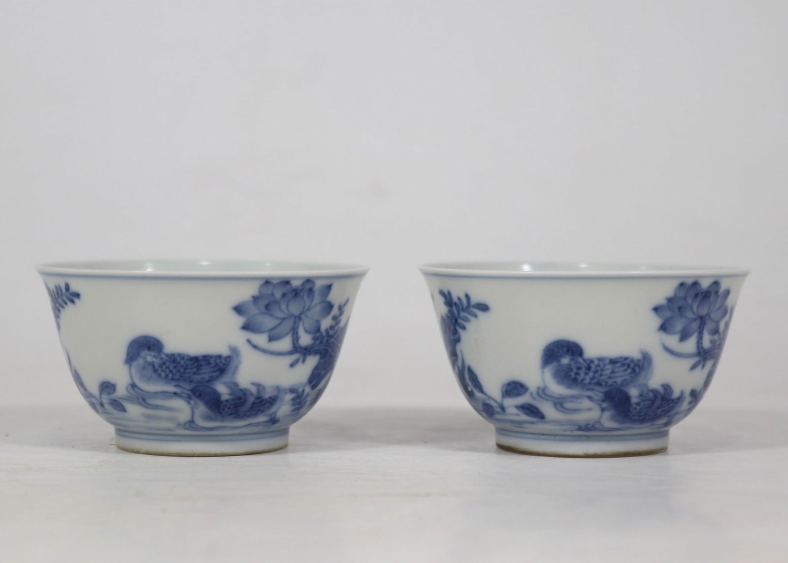 A pair of Exquisite Blue and White Flower and Bird Pattern Cup: A pair of Exquisite Blue and White Flower and Bird Pattern Cup,Qing Dynasty, China,Yongzheng Six-character Mark,Size:1.7inx3.1in 