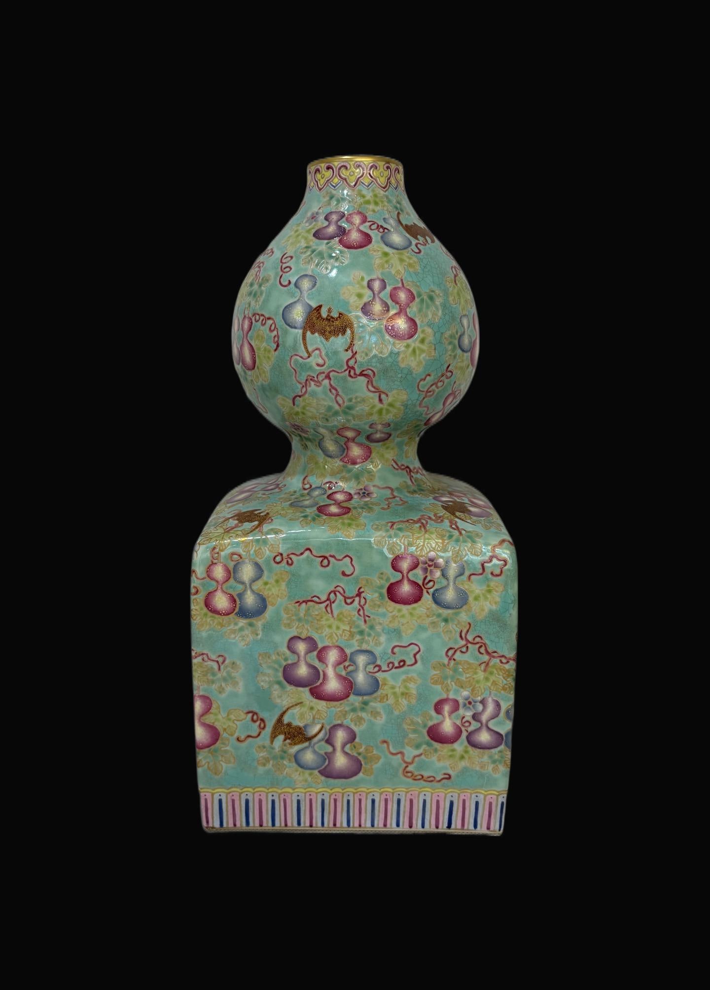 A Exquisite Famille-Rose Green Ground Painted Gold Gourd-Shaped Vase: A Exquisite Famille-Rose Green Ground Painted Gold Gourd-Shaped Vase,Qing Dynasty, China,Qianlong Six-character Mark,Size:13.8inx6.5in 粉彩绿地描金葫芦&