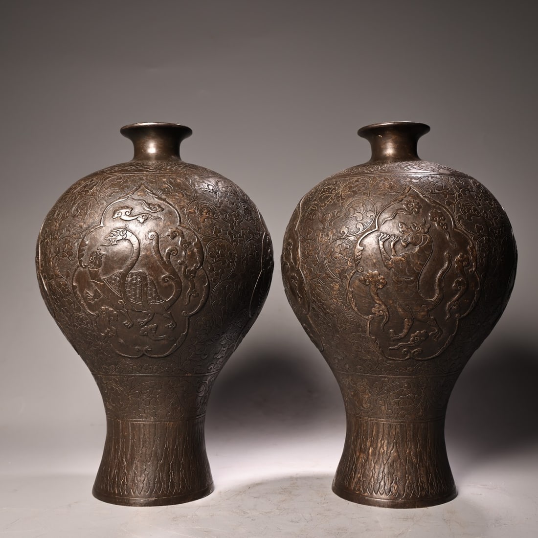 A pair of Exquisite Coppery High-relief Carved Four Mythical Beasts Vase: A pair of Exquisite Coppery High-relief Carved Four Mythical Beasts Vase,Qing Dynasty, China,Size:Single piece 12.6inx7.9in,Weight:2000g 