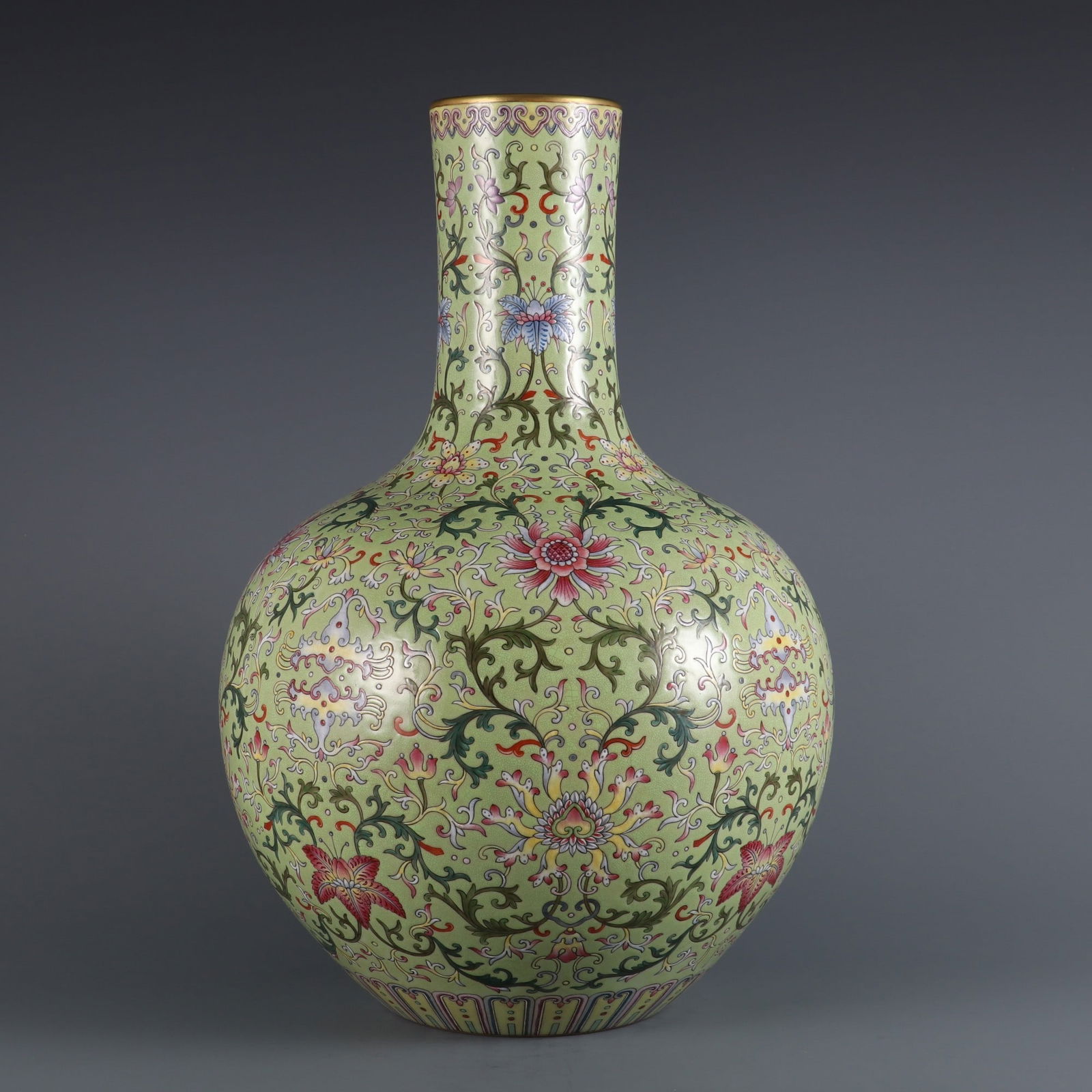 A Rare Green Ground Famille Rose Passion Flower Pattern Vase: A Rare Green Ground Famille Rose Passion Flower Pattern Vase,Qing Dynasty, China,Qianlong Six-character Mark,Size:15.8inx3.3in 