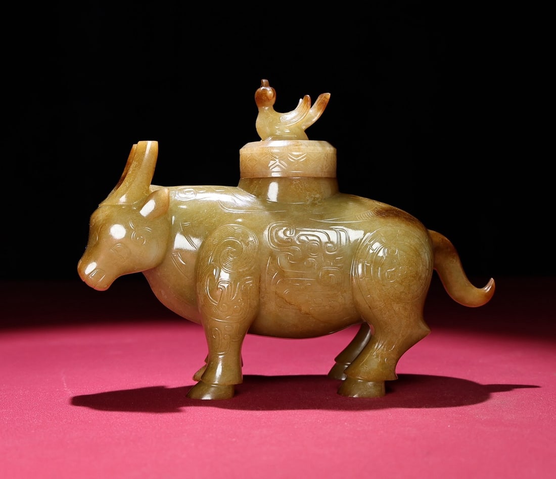 An Exquisite White Jade Buffalo ? Utensil: An Exquisite White Jade Buffalo 形 Utensil,Qing Dynasty,China,Size:7.5inx5.9inx2.6in,Weight:899g 白玉牛形器皿,中国清代