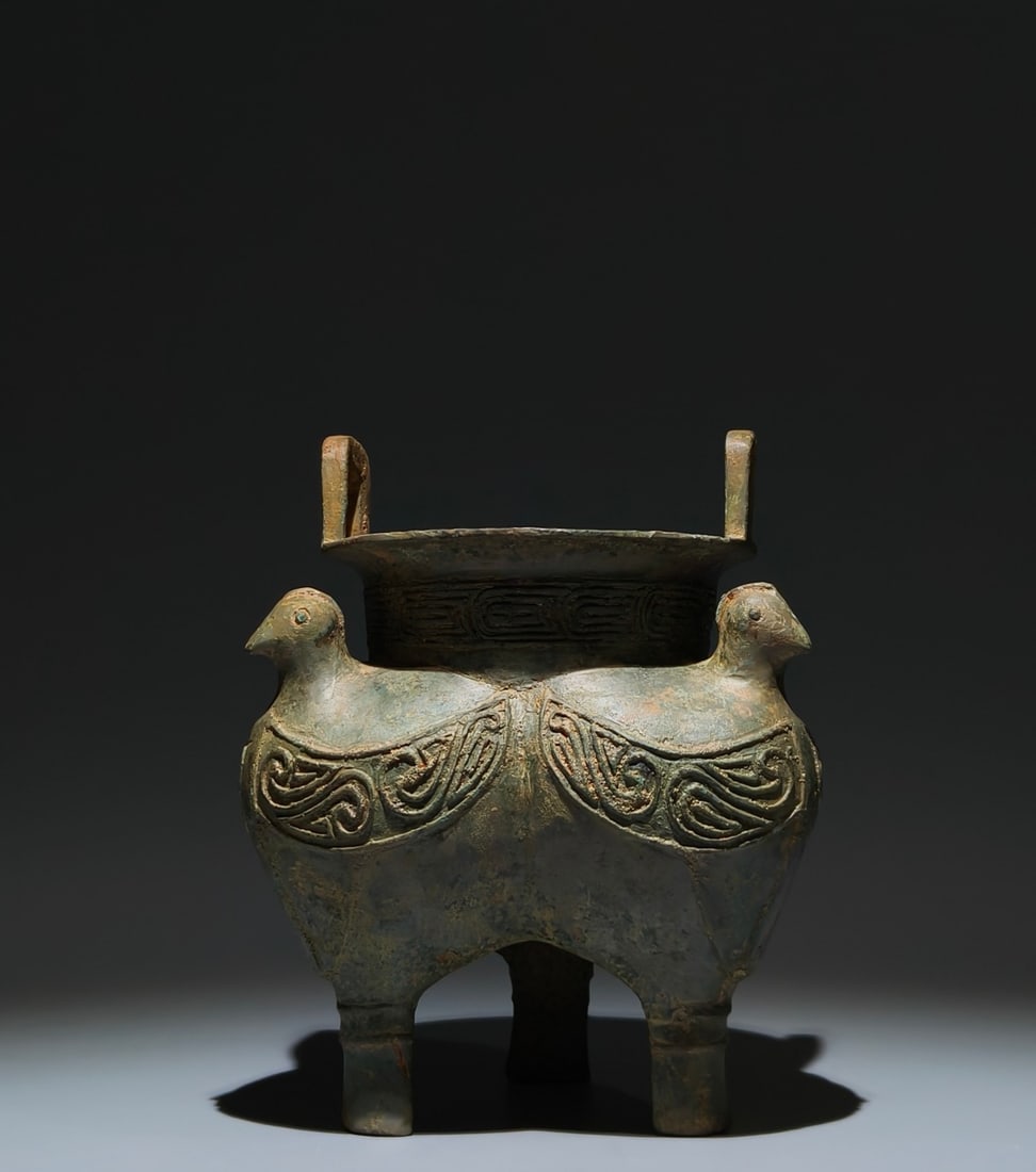 An Archaic Bronze Bird Pattern Double-Ears and Tripod Food Vessel: An Archaic Bronze Bird Pattern Double-Ears and Tripod Food Vessel,Shang Dynasty, China,Size:7.9inx6.3in 