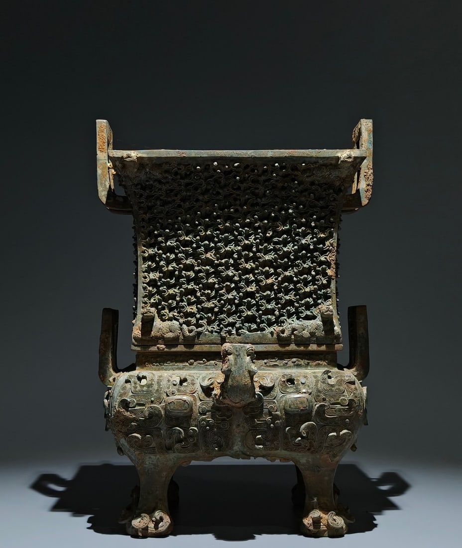 An Archaic Bronze Double-Ears Four Legs Food Vessel,With Base: An Archaic Bronze Double-Ears Four Legs Food Vessel,With Base,the Warring States period in China,Size:14.2inx9.8inx6.3in 青铜双耳四足食器,带ॵ
