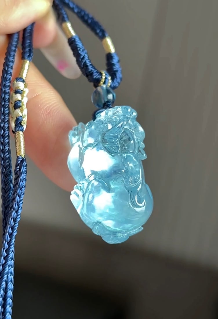An Exquisite Aquamarine Pi Xiu Pendant: An Exquisite Aquamarine Pi Xiu Pendant,Size:31mmx17.4mm,Total Weight:16.7g 海蓝宝貔貅吊坠