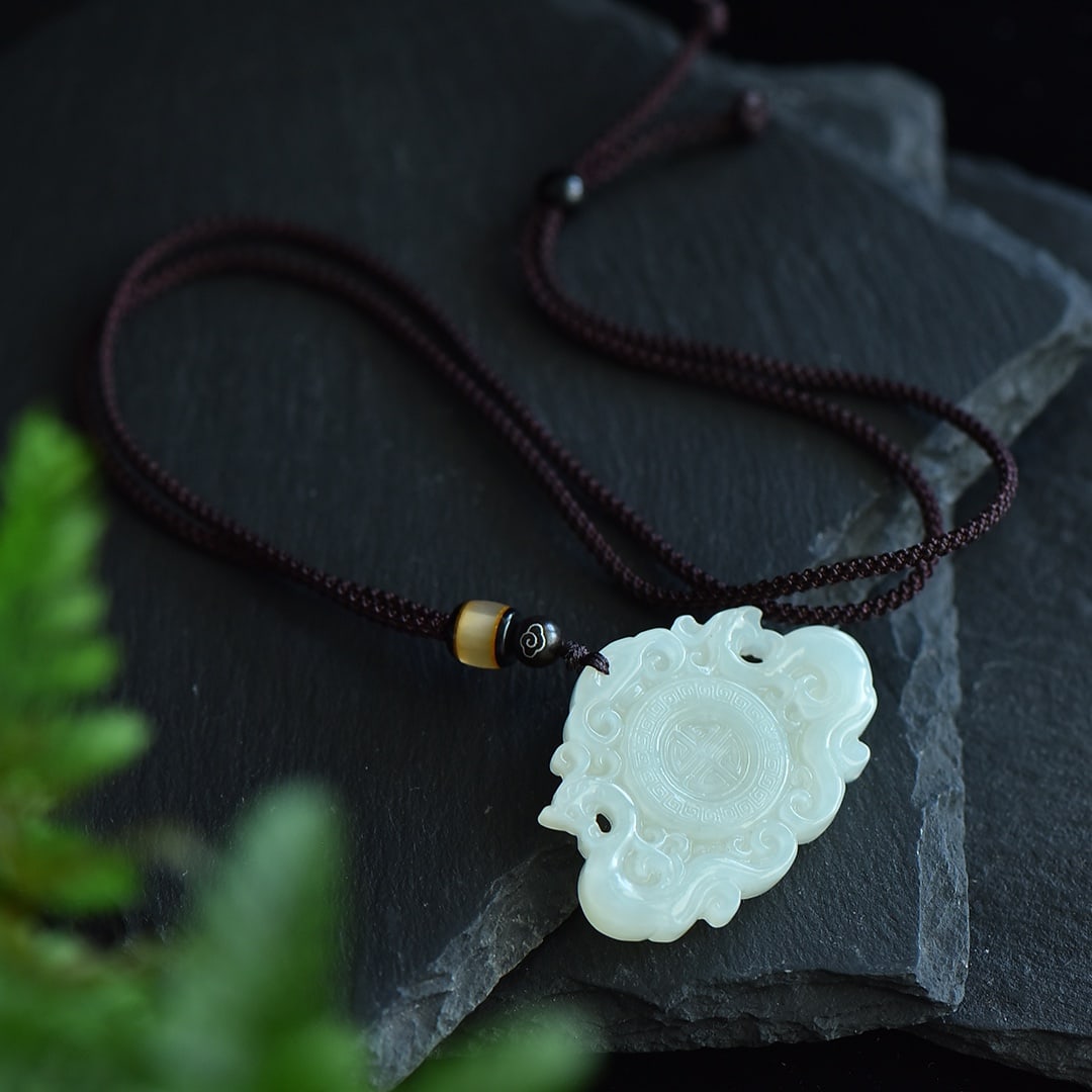 An Exquisite White Jade Dragon and Phoenix Pattern Pendant (1 of 5)