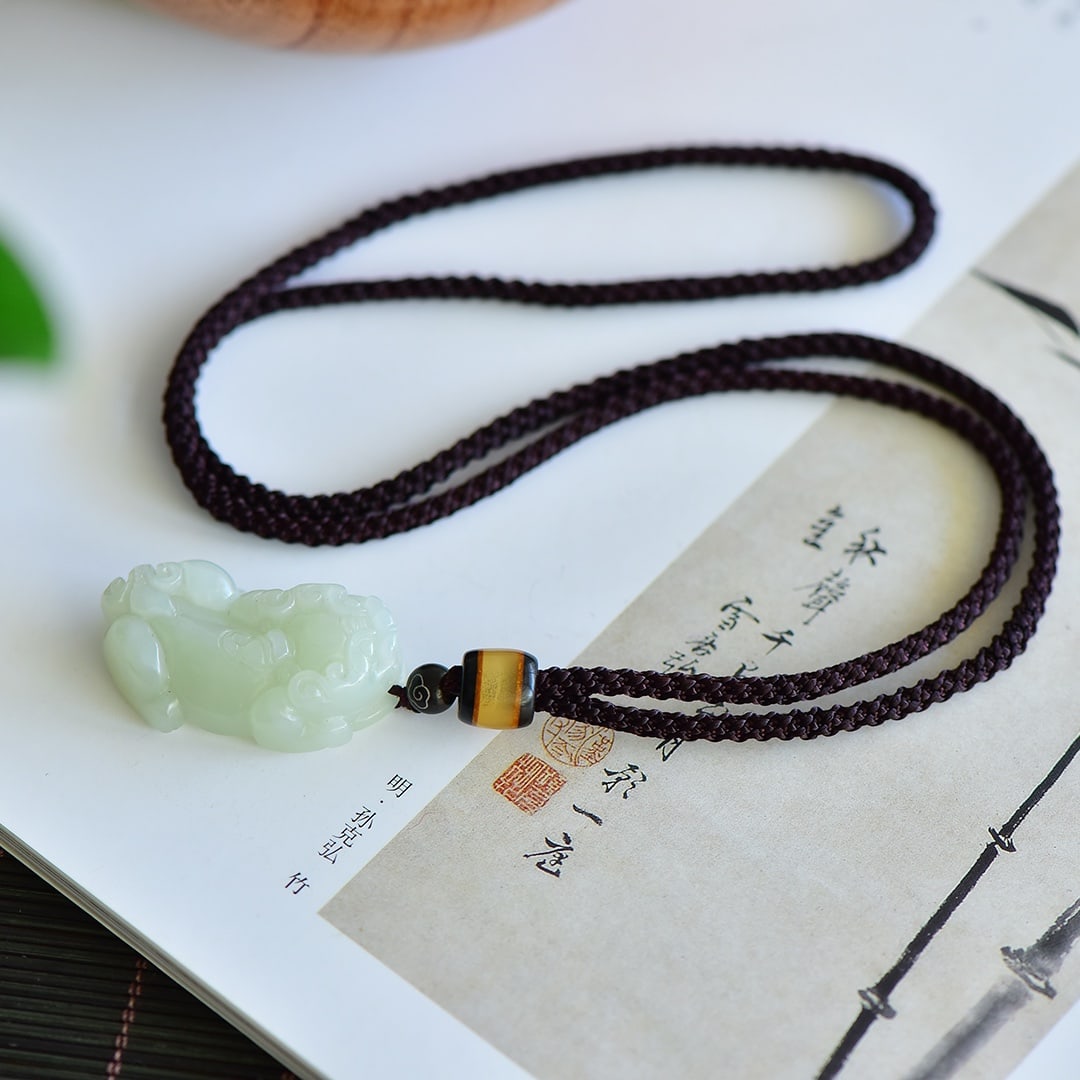 An Exquisite Greenish Jade Auspicious Beast Pendant (1 of 5)