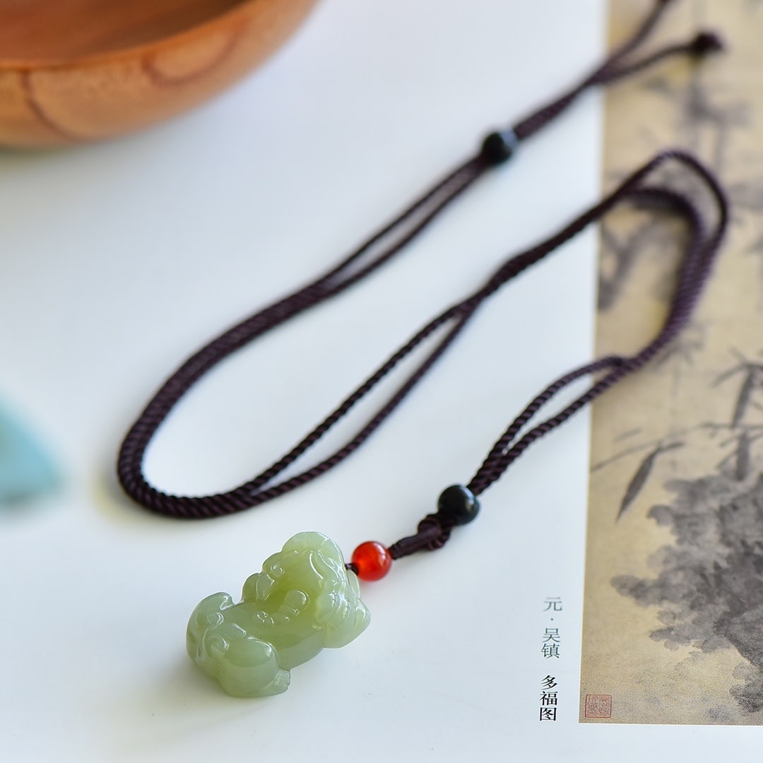 An Exquisite Greenish Jade Auspicious Beast Pendant (1 of 5)
