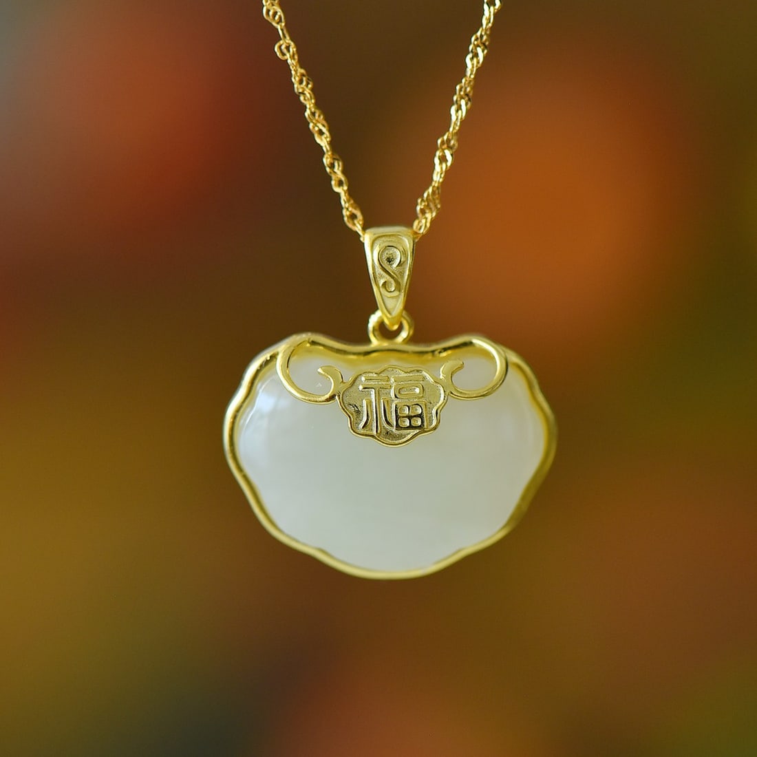 An Exquisite Sterling Silver-Gold Plated Inlaid White Jade Pendant: An Exquisite Sterling Silver-Gold Plated Inlaid White Jade Pendant 纯银镀金镶白玉吊坠