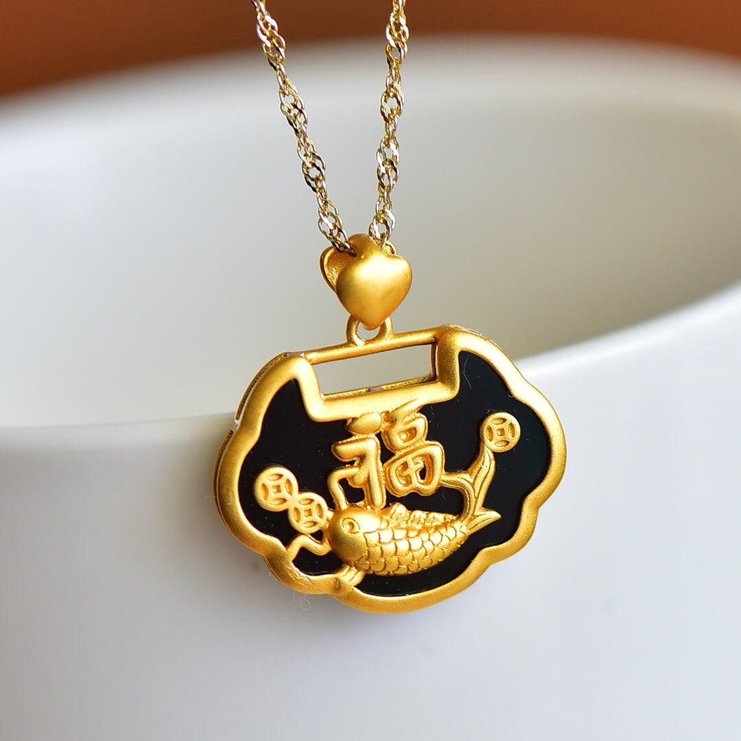 An Exquisite Sterling Silver-Gold Plated Inlaid Black Jade Pendant: Sterling Silver-Gold Plated Inlaid Black Jade Pendant , Size :15mmx20mm 纯银镀金镶黑玉吊坠,尺寸:15mmx20mm