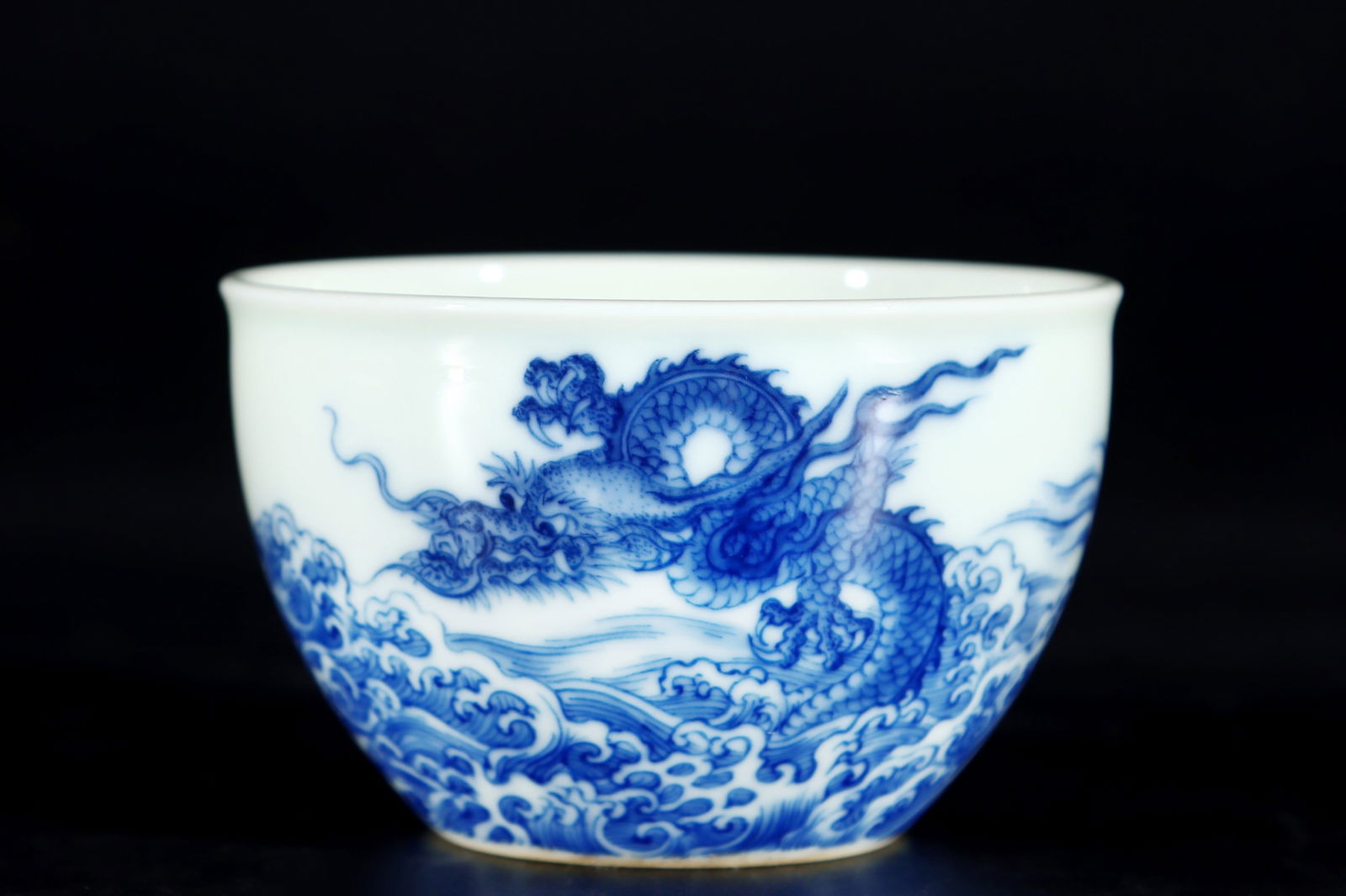 An Exquisite Blue and White Seawater and Dragon Pattern Cup: An Exquisite Blue and White Seawater and Dragon Pattern Cup,Qing Dynasty,China,Yongzheng Six-character Mark,Size:2inx3.3in 青花海水龙纹杯,中国