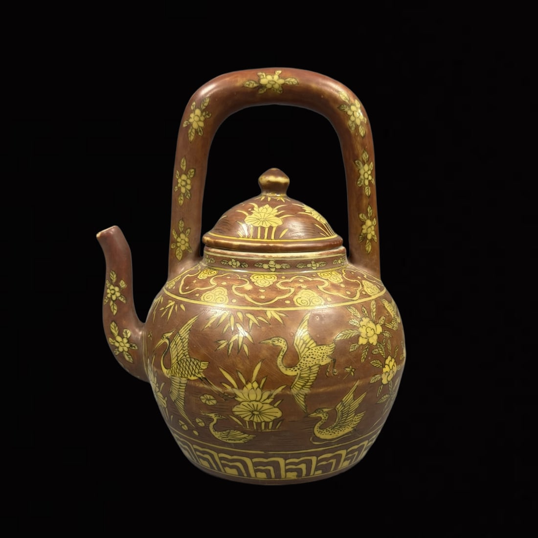 An Exquisite Yellow Glazed Flower and Crane Pattern Loop-handled Pot: An Exquisite Yellow Glazed Flower and Crane Pattern Loop-handled Pot,Ming Dynasty,China,Longqing Six-Character Mark,Size:9.4inx6.7in 