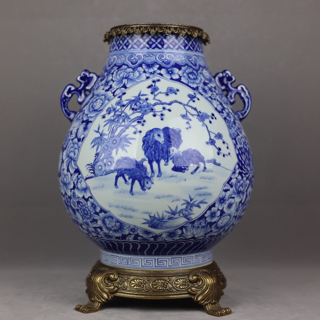 A Huge Blue and White Inlaid Bronze Sheep Pattern Double-Ears Jar: A Huge Blue and White Inlaid Bronze Sheep Pattern Double-Ears Jar,Qing Dynasty,China,Qianlong Six-Character Mark,Size:15.7inx10.6in 青花嵌铜羊纹双耳 