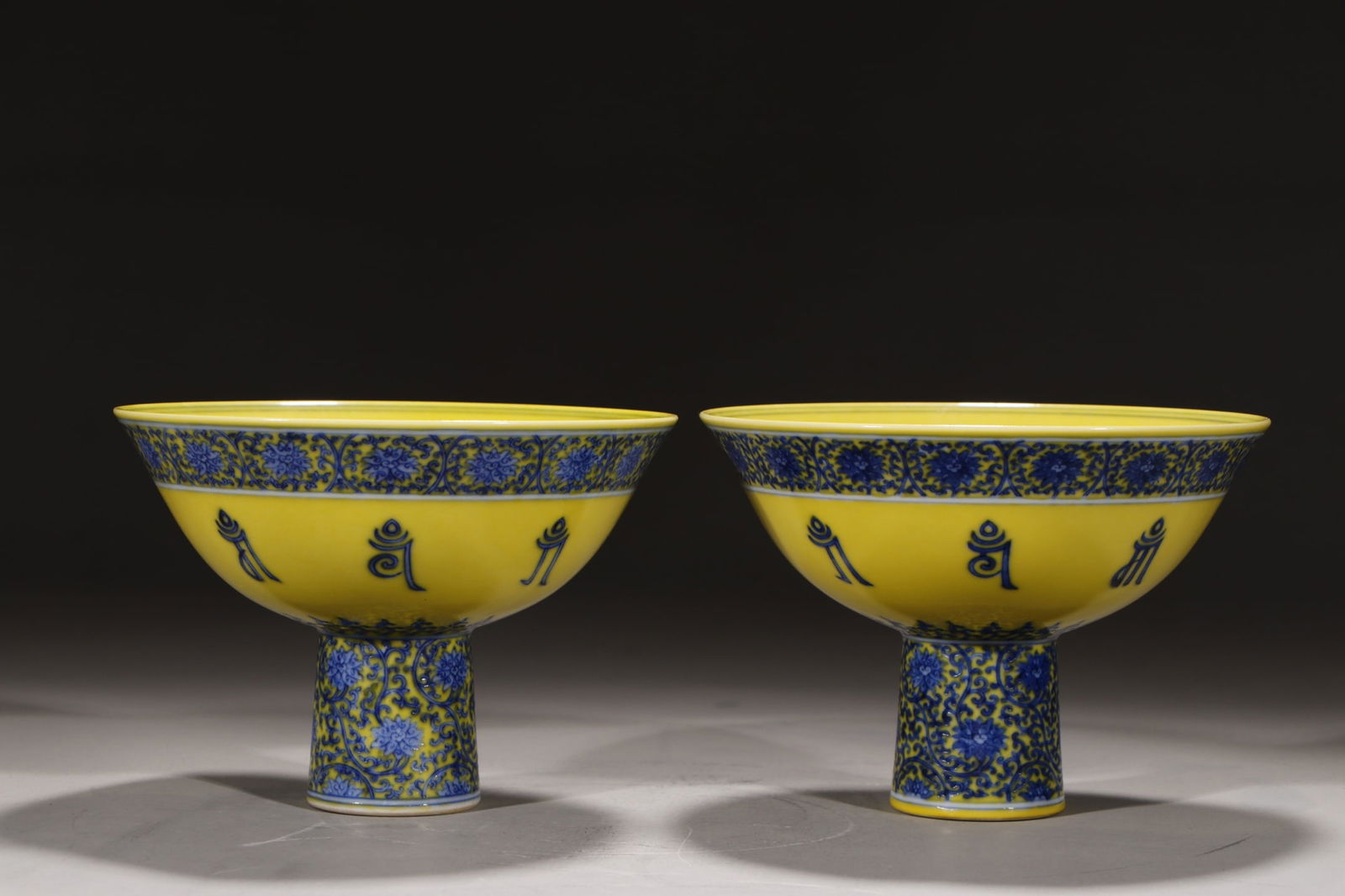 A Pair of Exquisite Yellow Ground Blue and White Lotus Pattern Stem Cups (1 of 9)