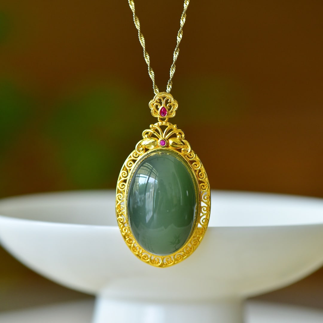 An Exquisite Sterling Silver-Gold Plated Inlaid Greenish Jade Pendant: An Exquisite Sterling Silver-Gold Plated Inlaid Greenish Jade Pendant,Size:0.8inx1.2in 纯银镀金镶青玉吊坠
