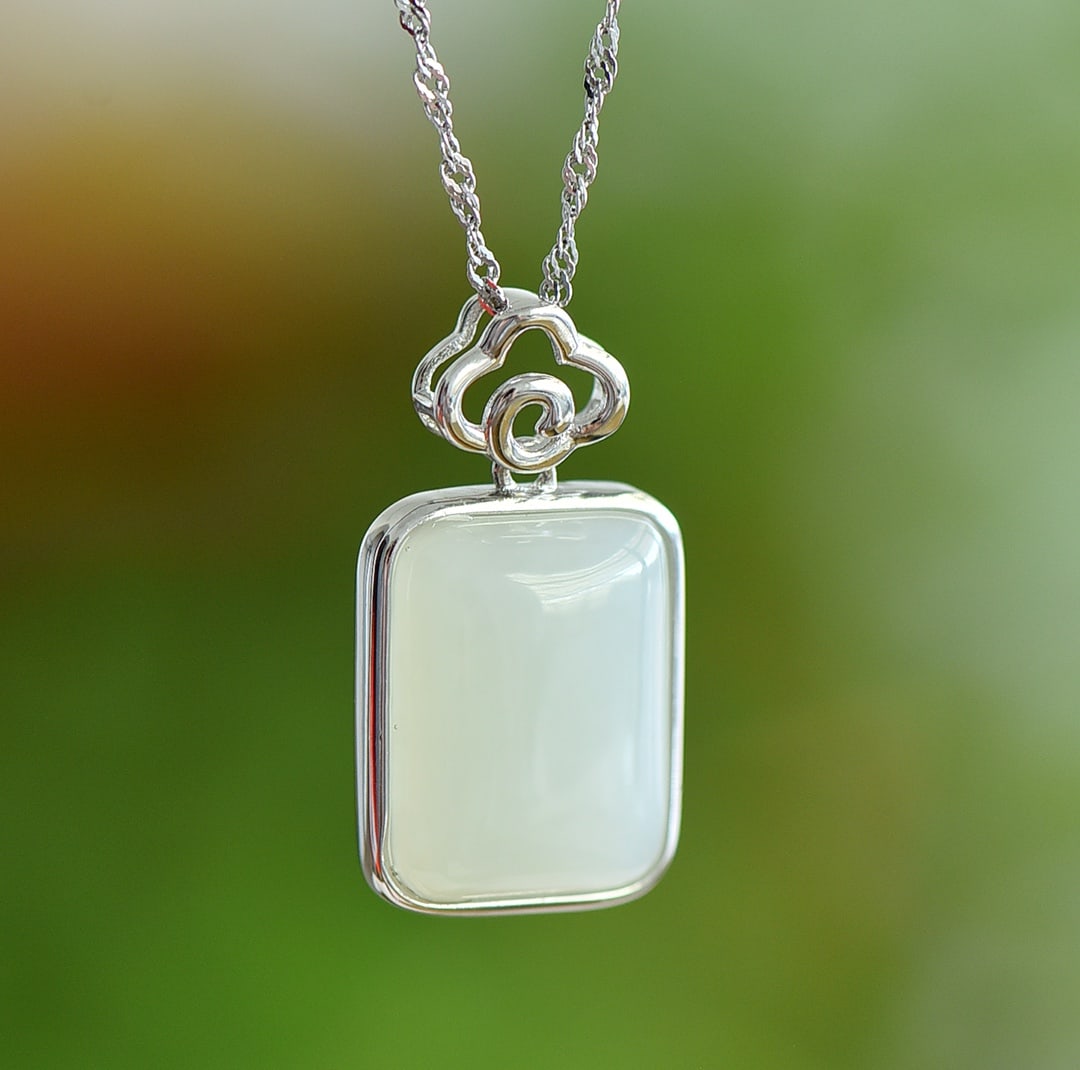 An Exquisite Sterling Silver Inlaid White Jade Pendant: An Exquisite Sterling Silver Inlaid White Jade Pendant,Size:0.5inx0.6in 纯银镶白玉吊坠