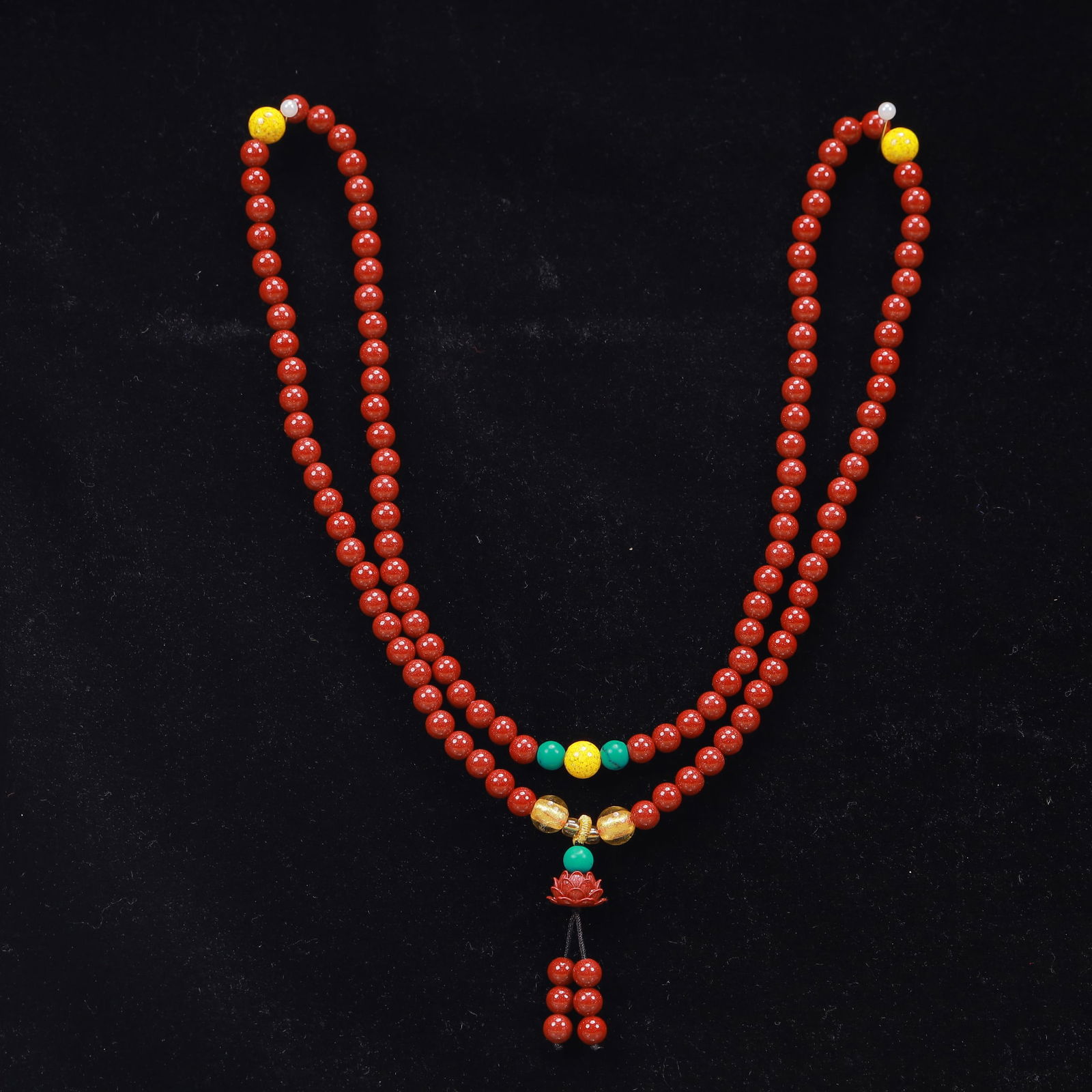 An Exquisite Cinnabar Lotus Pattern Pendant: An Exquisite Cinnabar Lotus Pattern Pendant, Size:19.3in, Weight:53g 朱砂莲花挂件