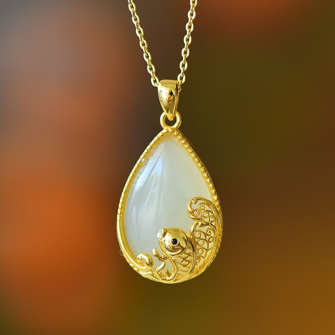 An Exquisite Sterling Silver-Gold Plated Inlaid White Jade Pendant: An Exquisite Sterling Silver-Gold Plated Inlaid White Jade Pendant 纯银镀金镶白玉吊坠