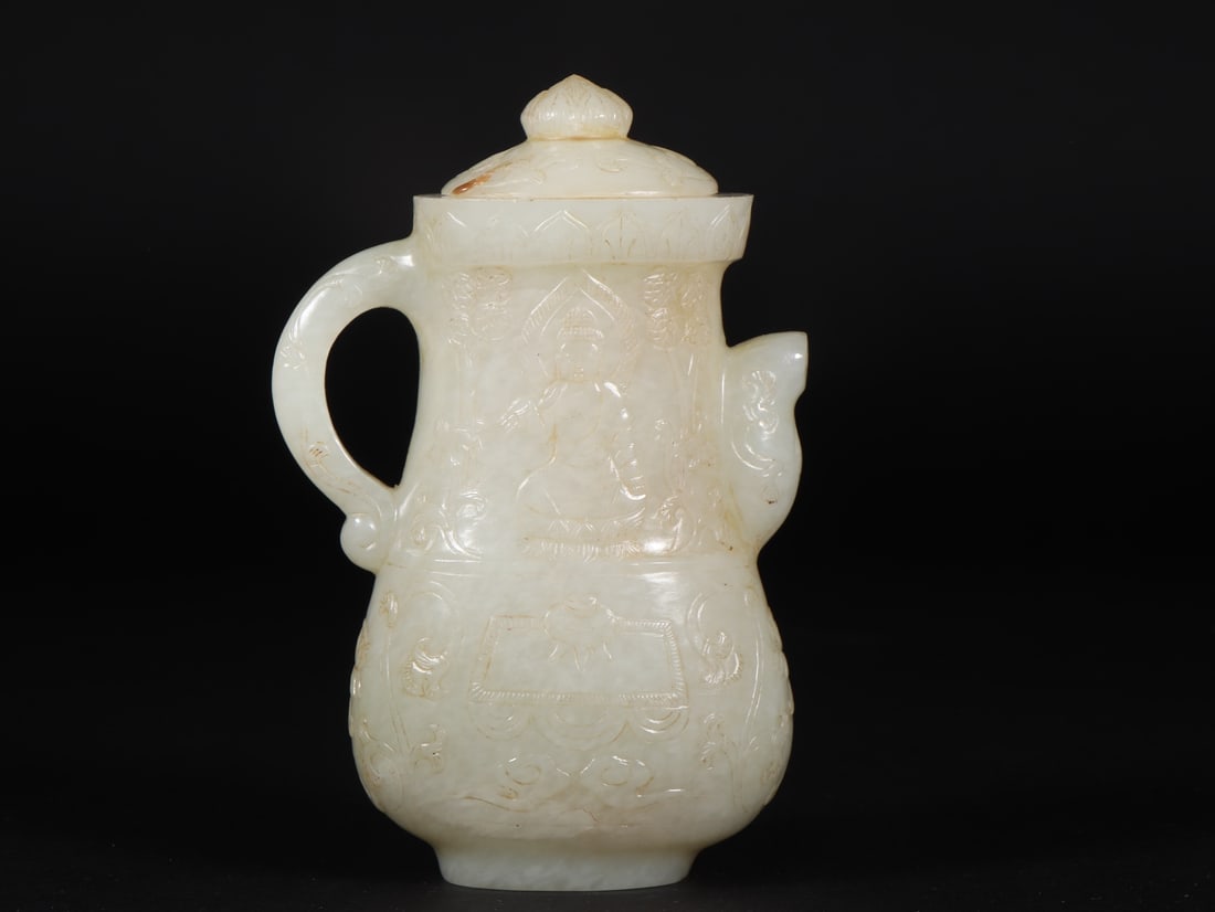 An Exquisite White Jade Buddha Statue Pattern Ewer: An Exquisite White Jade Buddha Statue Pattern Ewer Han Dynasty, China Size:3.3inx1.7inx4.9in Weight:269g白玉佛纹执壶 中国汉代 Size:8.3cmx4.4