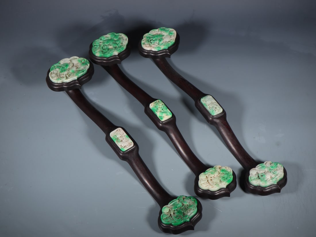 A Set of Fine Jadeite Flower and Bird Pattern Ruyi: A Set of Fine Jadeite Flower and Bird Pattern Ruyi Qing Dynasty, China Size:22inx5.1in Weight:3585g翡翠如意一套 中国清代 Size:56cmx13cm