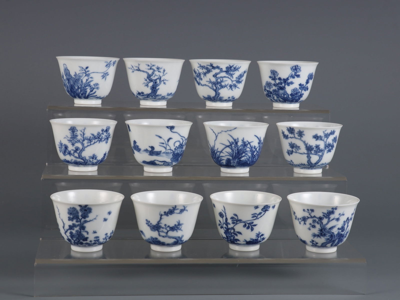 A Set of Fine Blue and White Flower Pattern with poem Cup: A Set of Fine Blue and White Flower Pattern with poem Cup Qing Dynasty, China Kangxi Six-character Mark Size:2inx2.7in青花十二花神杯一套 中&