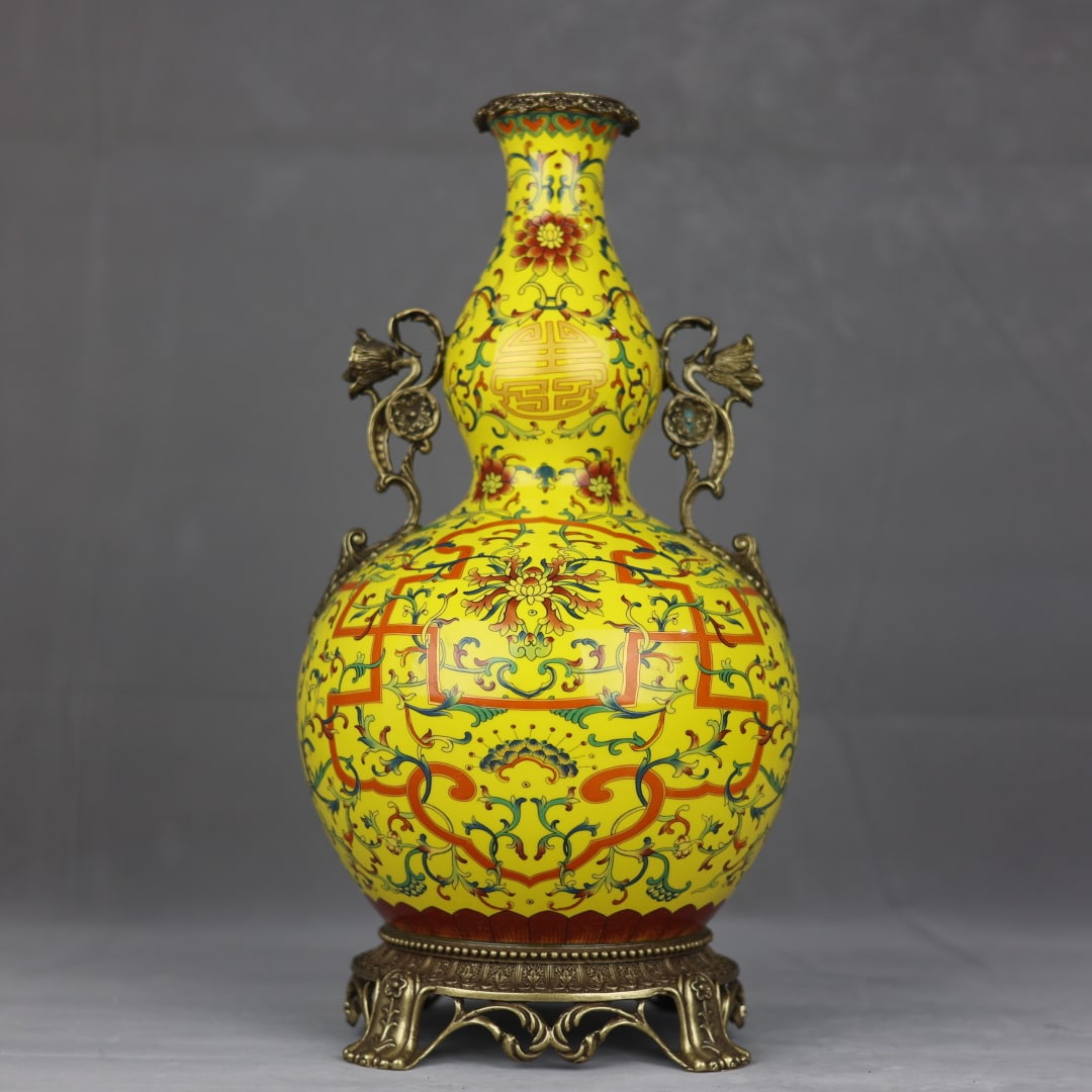 An Exquisite Enamel Inlaid Bronze Bats and Peach Pattern Lotus Pattern Gourd-Shaped Double-Ears Vase: An Exquisite Enamel Inlaid Bronze Bats and Peach Pattern Lotus Pattern Gourd-Shaped Double-Ears Vase Qing Dynasty, China Qianlong Six-character Mark Size:16.9inx8.3in黄地珐琅&#