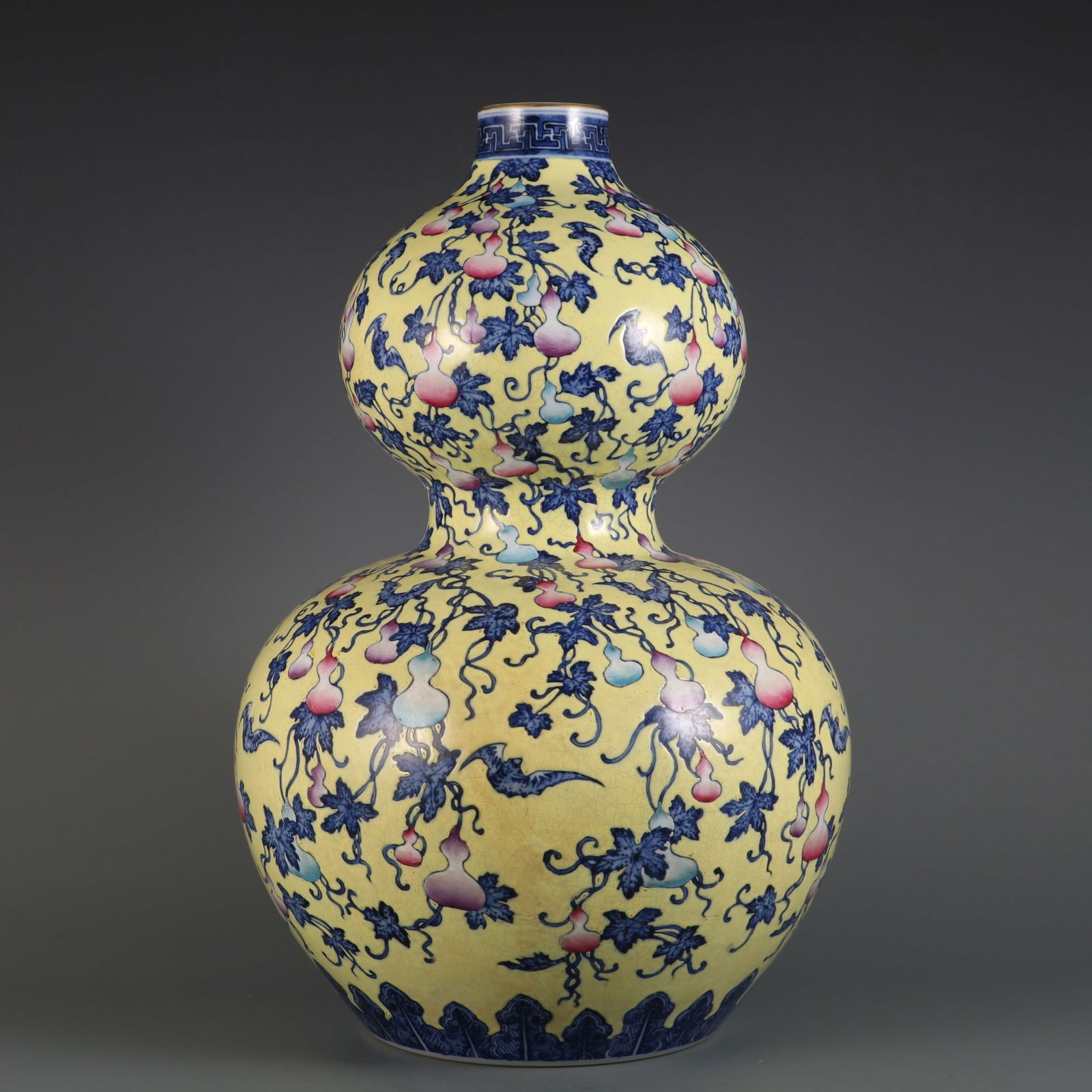 An Exquisite Famille-Rose Blue and White Bats and Peach Pattern Gourd-Shaped Vase: An Exquisite Famille-Rose Blue and White Bats and Peach Pattern Gourd-Shaped Vase Qing Dynasty, China Qianlong Six-character Mark Size:17.6inx11in黄地青花粉彩ధ