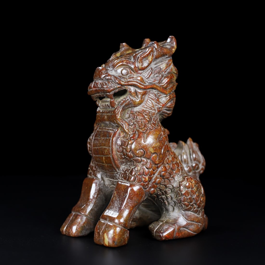 An Exquisite White Jade Kylin Ornament: An Exquisite White Jade Kylin Ornament Han Dynasty, China Size:5.5inx4.6inx3in Weight:954.5g白玉麒麟 中国汉代 Size:14cmx11.7cmx7.5cm Weight:954.5g