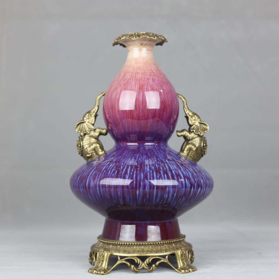 An Exquisite Flambe Glazed Inlaid Bronze Gourd-Shaped Double-Ears Vase: An Exquisite Flambe Glazed Inlaid Bronze Gourd-Shaped Double-Ears Vase Qing Dynasty, China Qianlong Six-character Mark