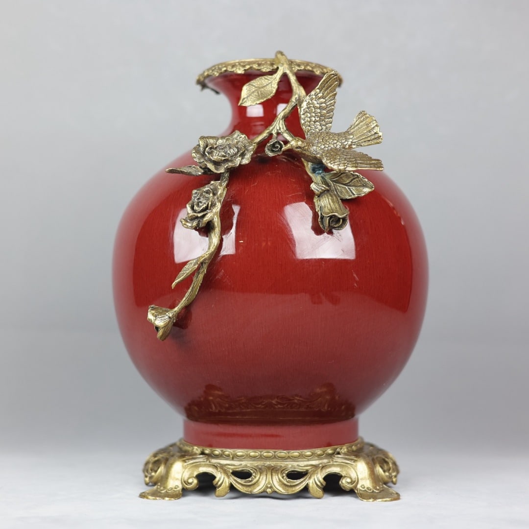 An Exquisite Red Glazed Inlaid Bronze Flower and Bird Pattern Vase: An Exquisite Red Glazed Inlaid Bronze Flower and Bird Pattern Vase Qing Dynasty, China Qianlong Six-character Mark Size:13inx9.8in郎红釉镶铜花鸟苹ੜ