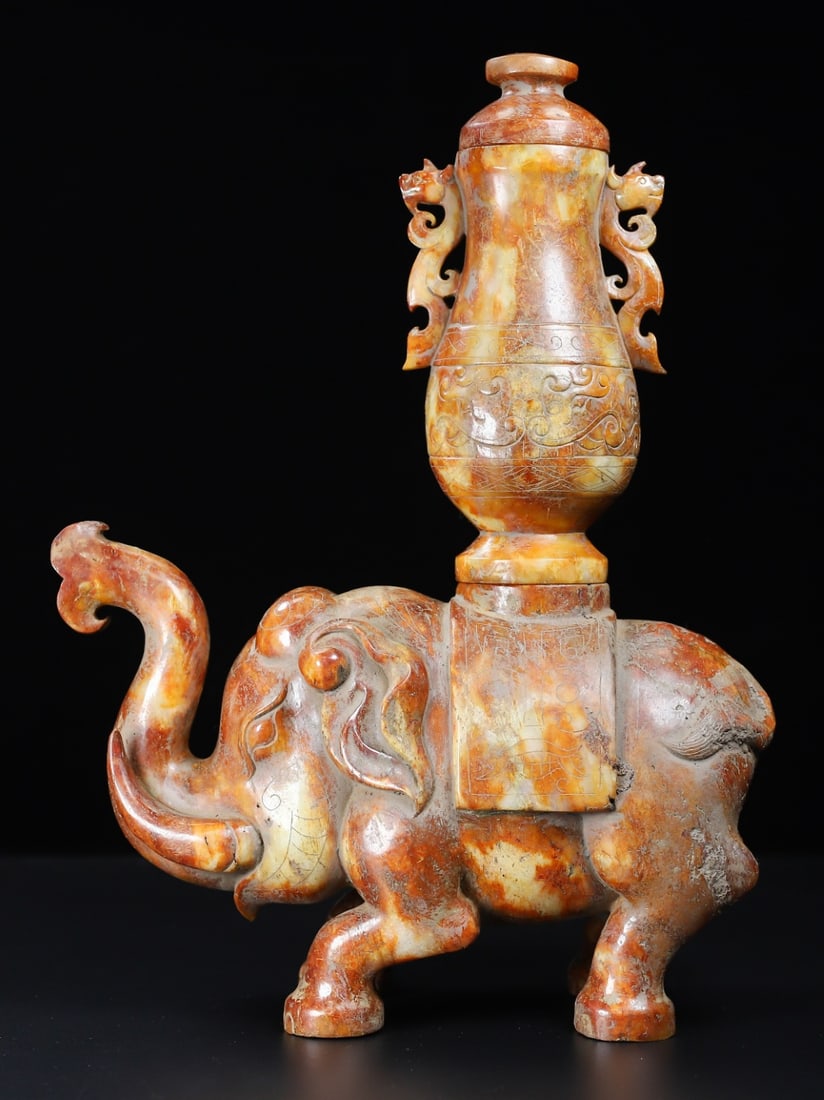 An Exquisite White Jade Elephant-Shaped Vase: An Exquisite White Jade Elephant-Shaped Vase Han Dynasty, China Size:11.8inx8.8inx3.5in Weight:3.954kg白玉太平有象 中国汉代 Size:30cmx22.3cm
