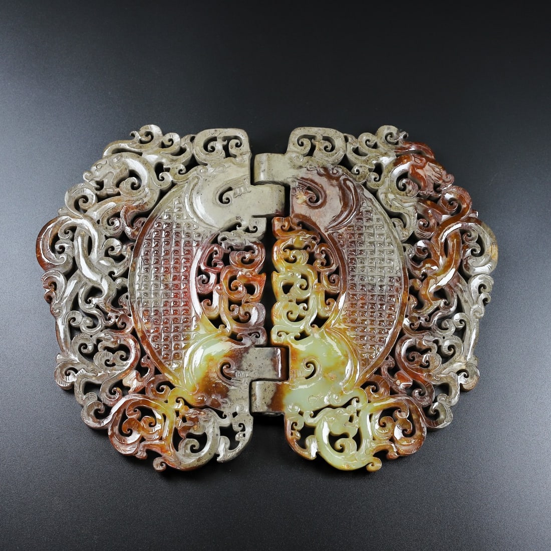 An Exquisite White Jade Dragon and Phoenix Pattern Ornament: An Exquisite White Jade Dragon and Phoenix Pattern Ornament Han Dynasty, China Size:10.6inx8.1inx0.7in Weight:791g白玉折叠玉璧 中国汉代