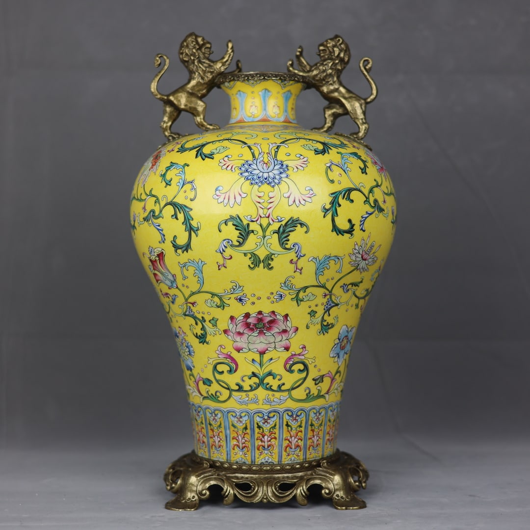 An Exquisite Famille-Rose Inlaid Bronze Lotus Pattern Double-Ears Vase: An Exquisite Famille-Rose Inlaid Bronze Lotus Pattern Double-Ears Vase Qing Dynasty, China Qianlong Four-character Mark Size:19.3inx9.8in粉彩扒花镶铜狮子