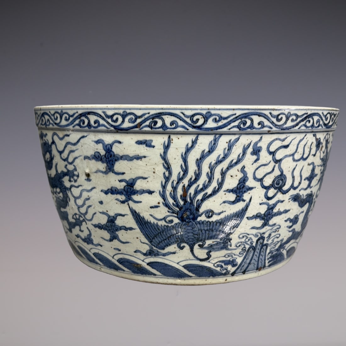 An Exquisite Blue and White Dragon and Phoenix Pattern Seawater Pattern Vat: An Exquisite Blue and White Dragon and Phoenix Pattern Seawater Pattern Vat Qing Dynasty, China Size:9.4inx23.6in青花龙凤纹海水纹缸