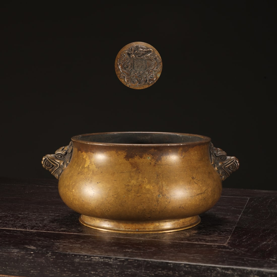 An Exquisite Bronze Dragon Pattern Double-Ears Censer: An Exquisite Bronze Dragon Pattern Double-Ears Censer Ming Dynasty, China Xuande Six-character Mark Size:3.1inx6in Weight:1500g铜象首耳炉