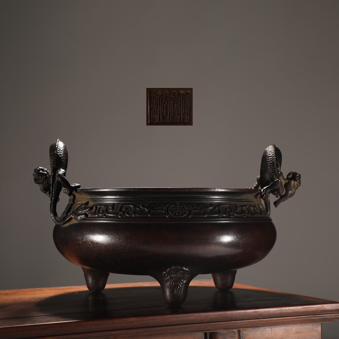 An Exquisite Bronze Dragon Pattern Double-Ears and Tripod Censer: An Exquisite Bronze Dragon Pattern Double-Ears and Tripod Censer Ming Dynasty, China Xuande Four-character Mark Size:7.9inx10.2in