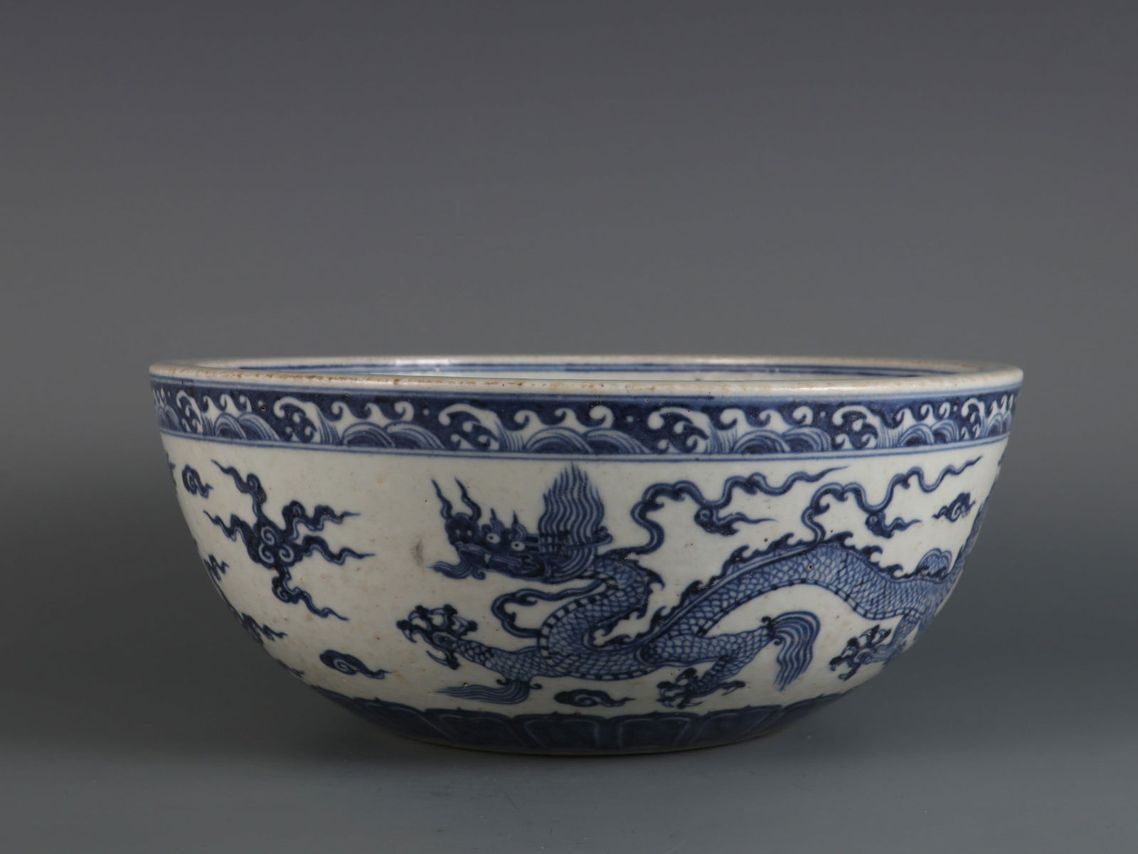 An Exquisite Blue and White Seawater Pattern Dragon Pattern Bowl: An Exquisite Blue and White Seawater Pattern Dragon Pattern Bowl Ming Dynasty, China Xuande Six-character Mark Size:4.5inx11.1in青花云龙纹钵 中国明