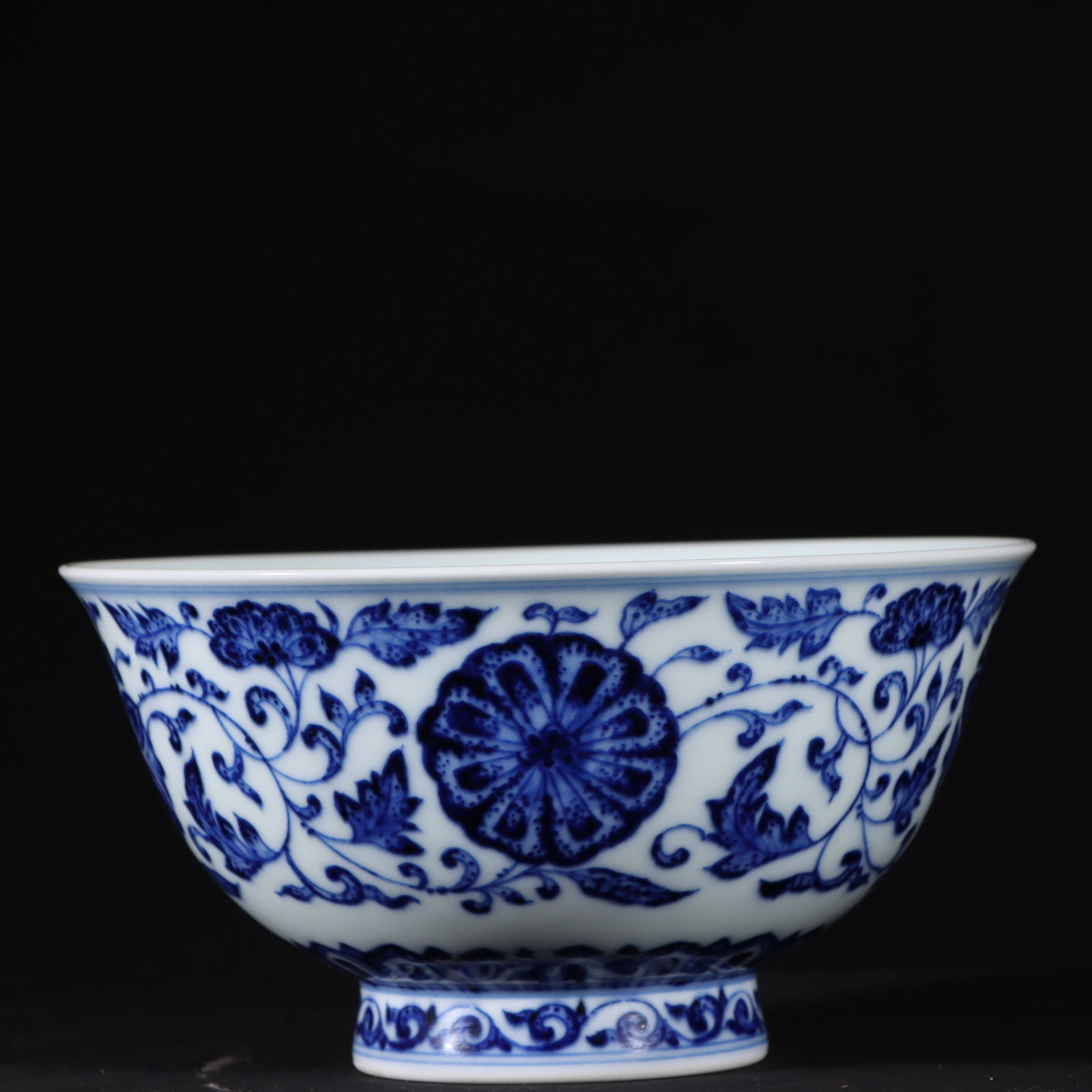 An Exquisite Blue and White Lotus Pattern Bowl: An Exquisite Blue and White Lotus Pattern Bowl Qing Dynasty, China Qianlong Six-character Mark Size:2.7inx5.1in青花缠枝花卉纹碗