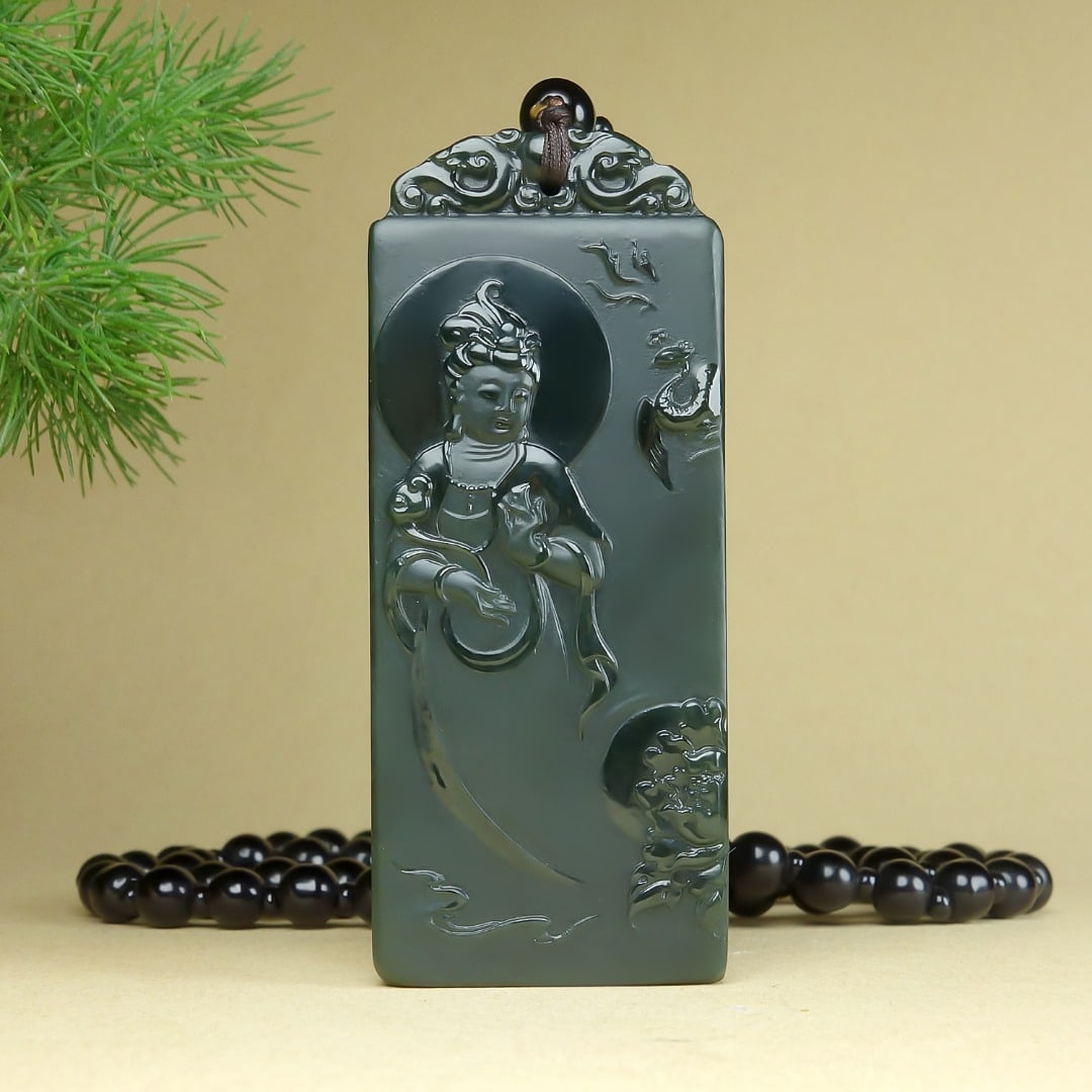 An Exquisite Greenish Jade Statue of Avalokitesvara Pendant: An Exquisite Greenish Jade Statue of Avalokitesvara Pendant,Size:64mmx26.5mmx9mm 青玉观音像挂件