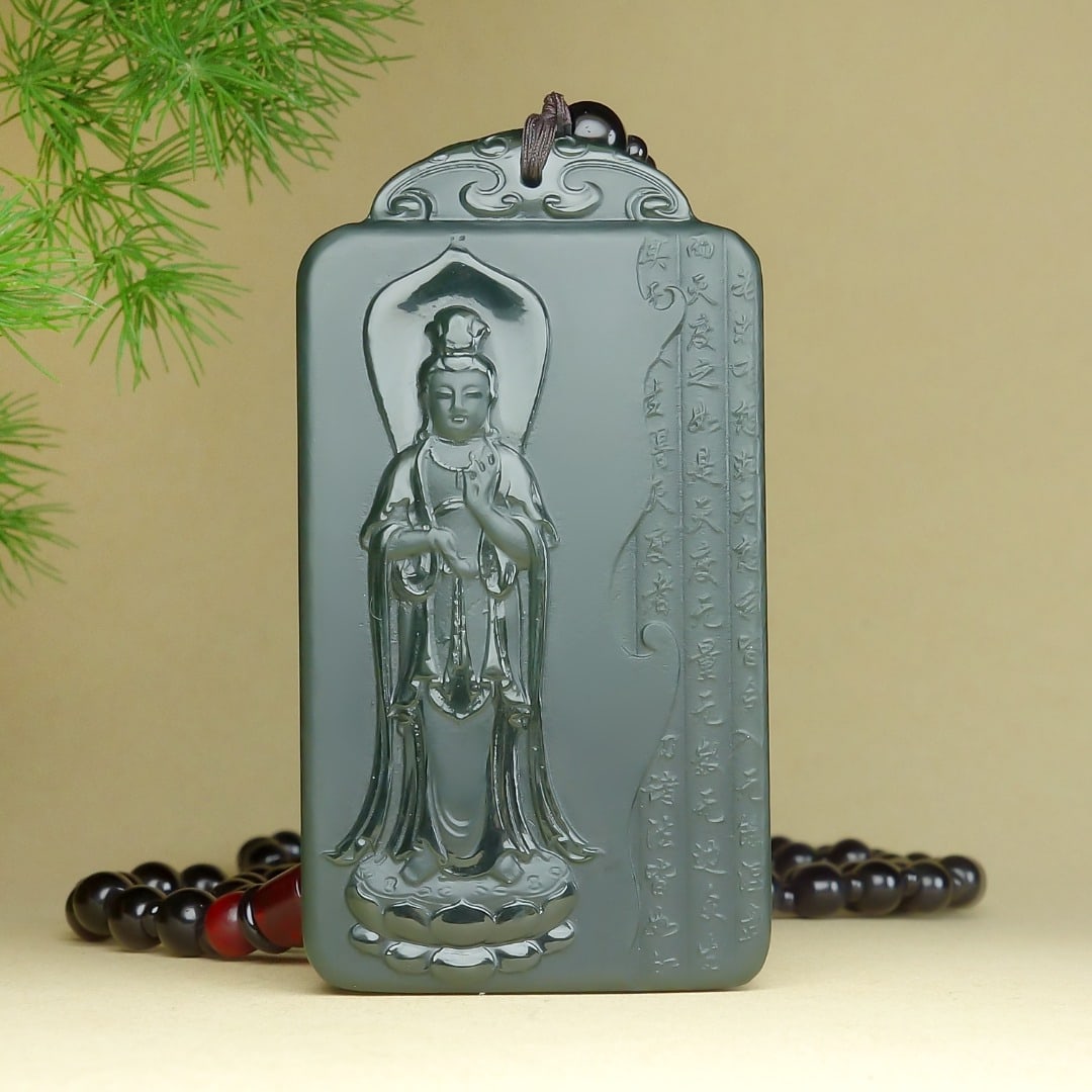 An Exquisite Greenish Jade Statue of Avalokitesvara Pendant: An Exquisite Greenish Jade Statue of Avalokitesvara Pendant,Size:64mmx34mmx9mm 青玉观音像挂件