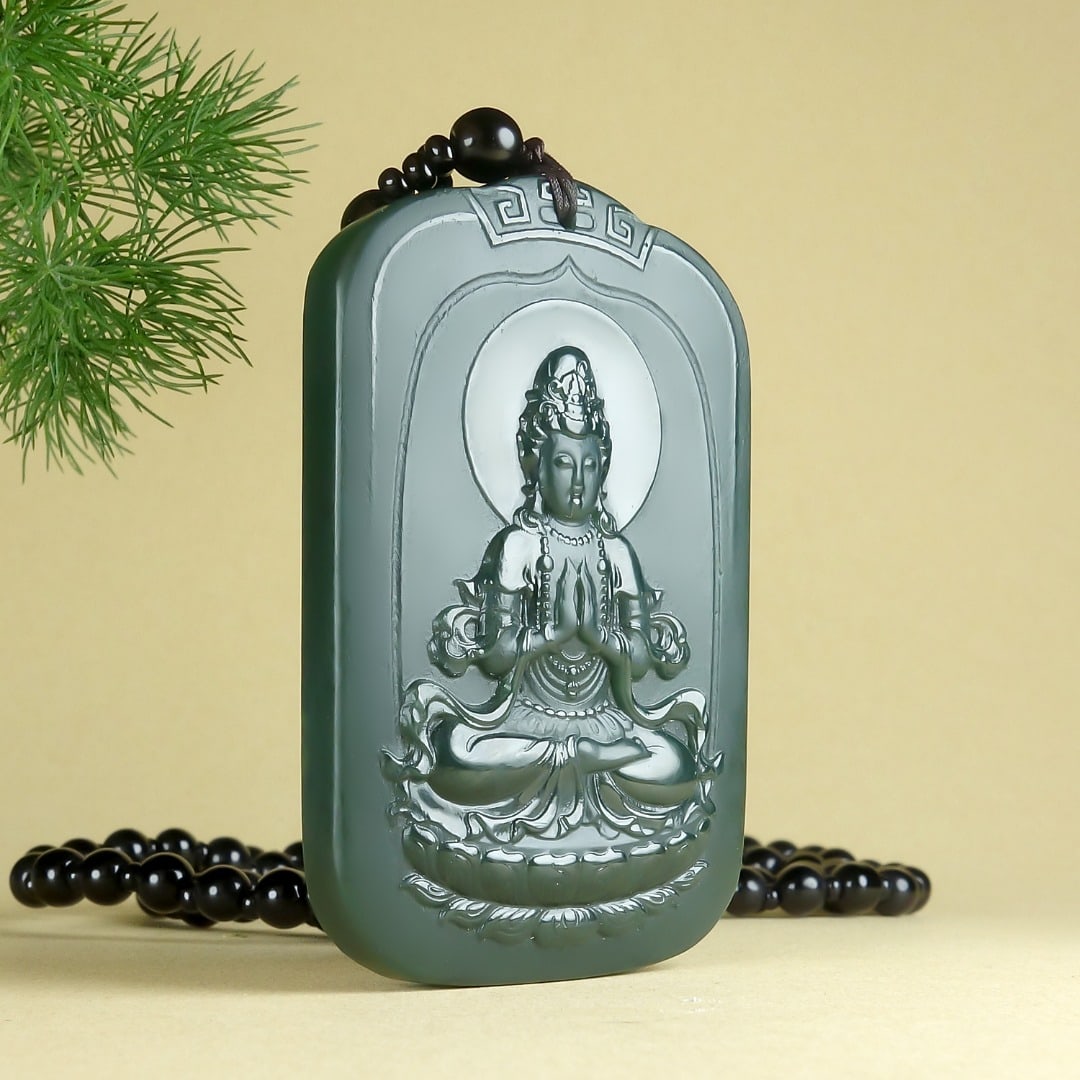 An Exquisite Greenish Jade Statue of Avalokitesvara Pendant: An Exquisite Greenish Jade Statue of Avalokitesvara Pendant,Size:64mmx41mmx10mm 青玉观音像挂件