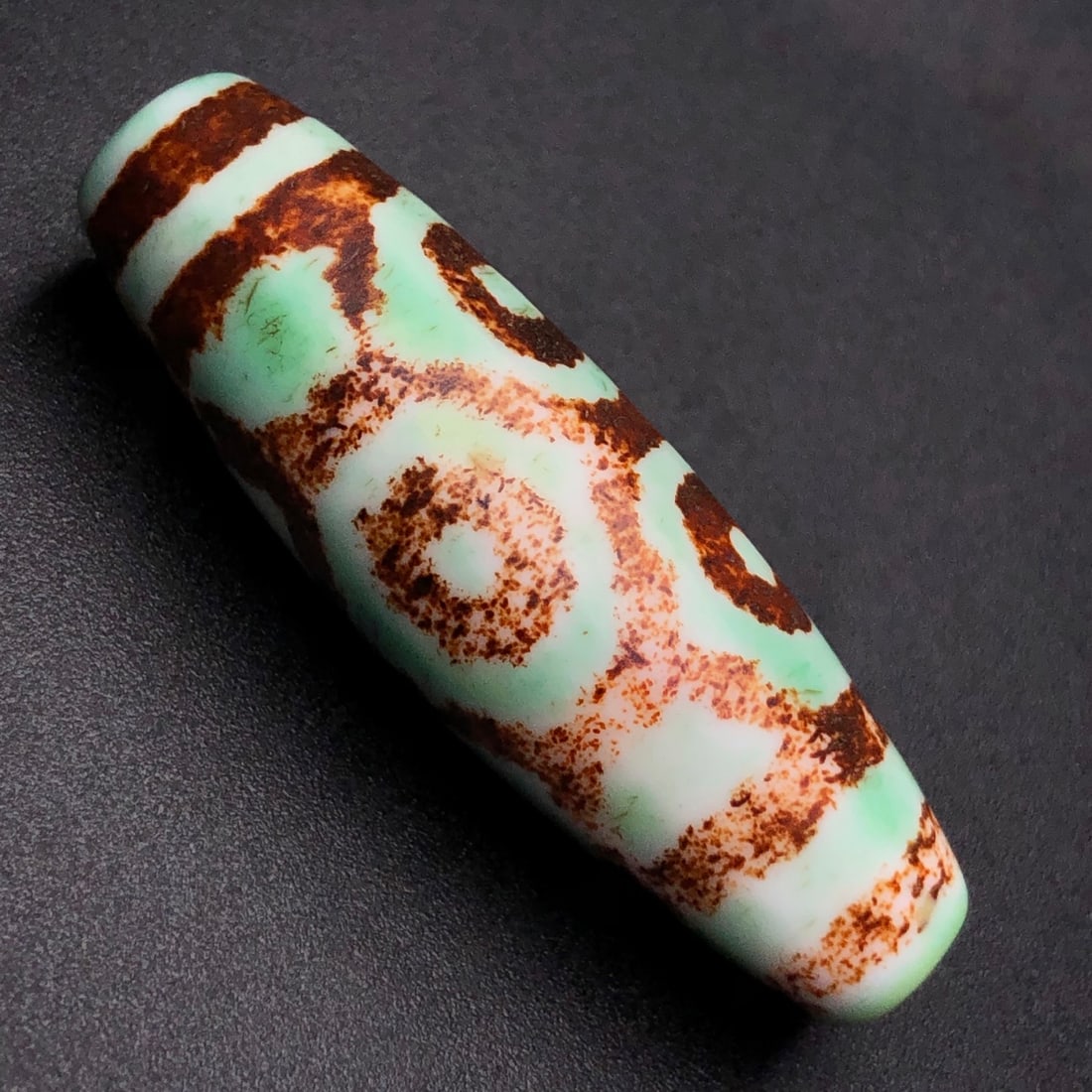 An Exquisite Six Eyes Dzi Bead Pendant: An Exquisite Six Eyes Dzi Bead Pendant,Size:47mmx15mm,Weight:15.2g 六眼天珠挂件