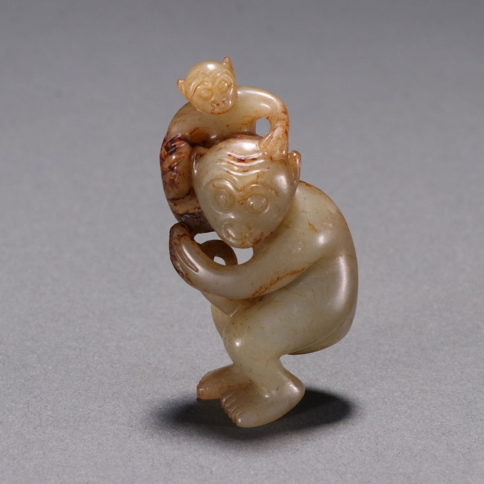 A Exquisite Hotan Jade Monkey Ornament: A Exquisite Hotan Jade Monkey Ornament,Qing Dynasty, China,Size:2.6inx1.3in,Weight:52g 和田玉猴摆件,中国清代