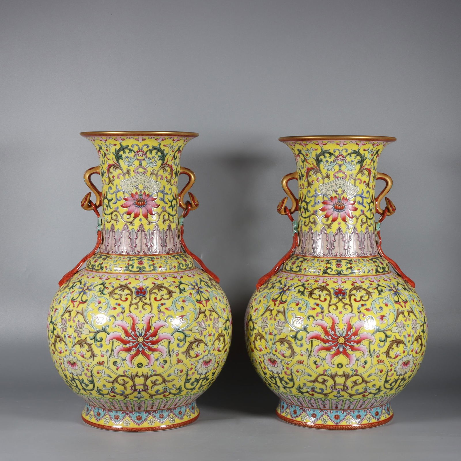 A pair of Exquisite Famille-Rose Yellow Ground Lotus Pattern Double Ears Vase: A pair of Exquisite Famille-Rose Yellow Ground Lotus Pattern Double Ears Vase,Qing Dynasty, China,Qianlong Six-character Mark,Size:14.4inx5.7inx5.8in 