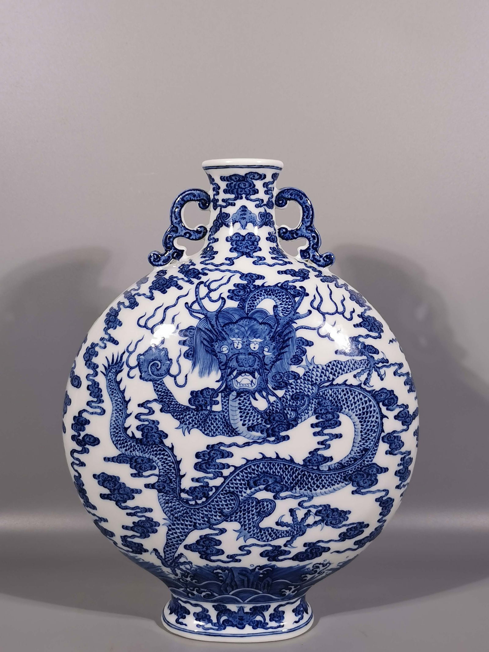 A Exquisite Blue and White Dragon Pattern Double-Ears Vase: A Exquisite Blue and White Dragon Pattern Double-Ears Vase,Qing Dynasty, China,Qianlong Six-character Mark,Size: 11.8inx8.9in 