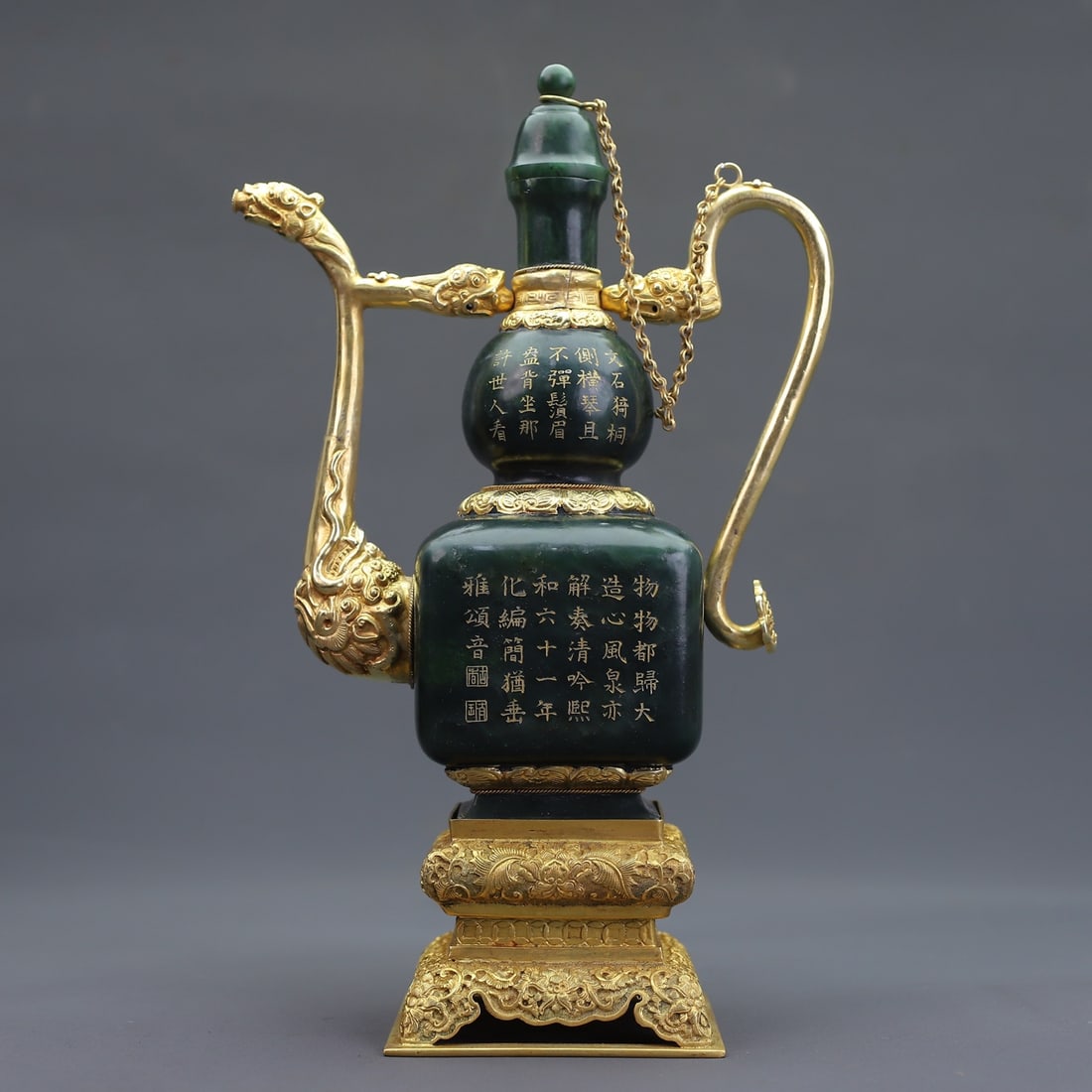 A Exquisite Hetian Jasper Gilt Ewer: A Exquisite Hetian Jasper Gilt Ewer,Qing Dynasty, China,Qianlong Four-character Mark,Size:4.9inx14.3inx10inx11inx6.7inx3.5in,Weight:3040g 
