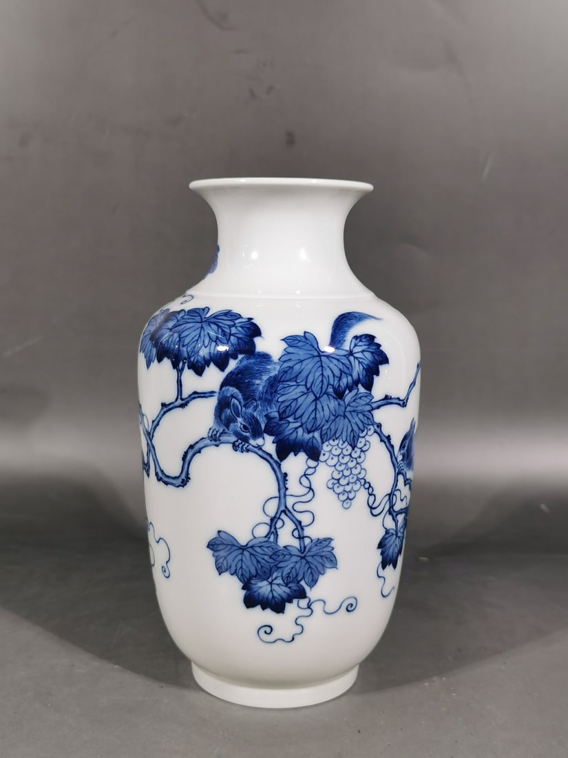 A Exquisite Blue and White Squirrel and Grapes Pattern Vase: A Exquisite Blue and White Squirrel and Grapes Pattern Vase,Qing Dynasty, China,Yongzheng Six-character Mark,Size: 7.3inx2.6inx4.1in 