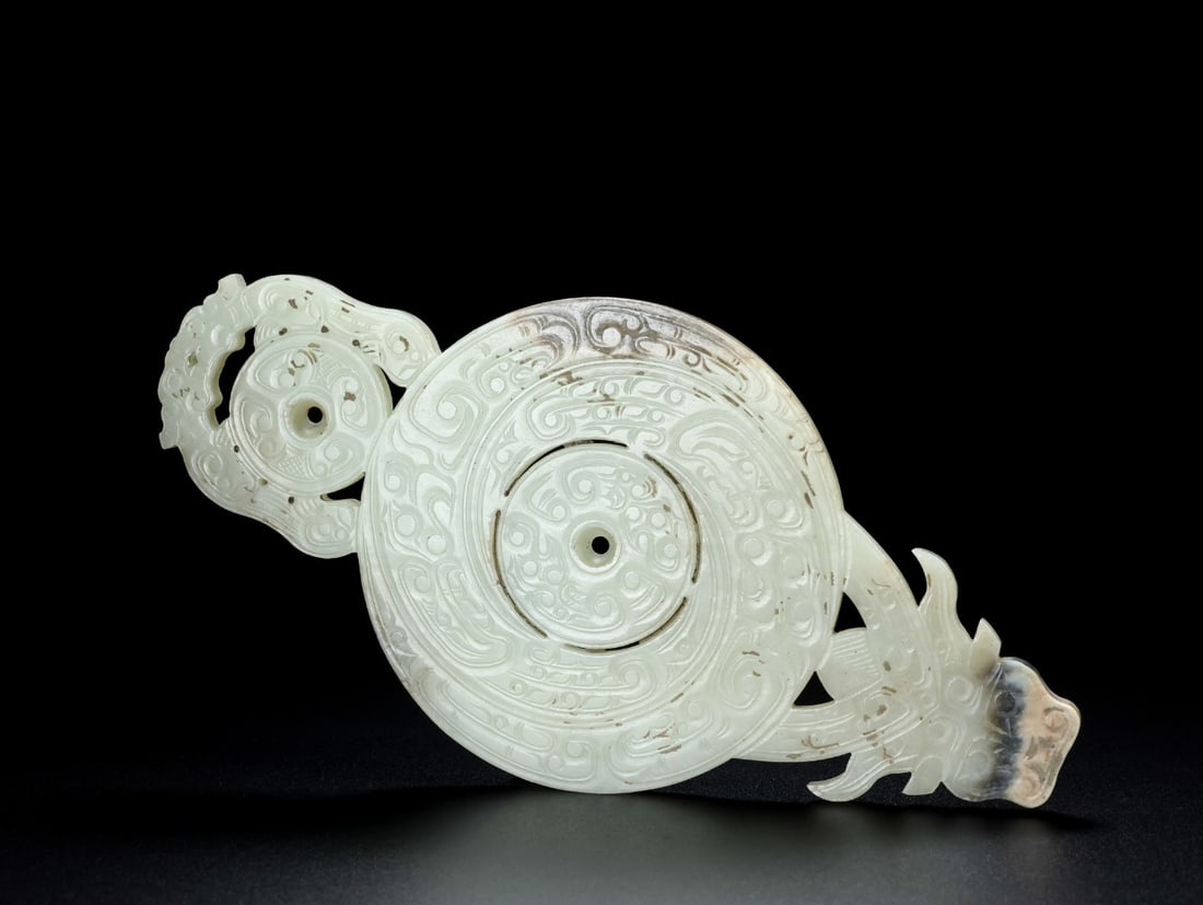 A Exquisite Hotan Jade Ox Head Jade Bi: A Exquisite Hotan Jade Ox Head Jade Bi,Qing Dynasty, China,Size:7.7inx3.8inx0.2in,Weight:166.8g 和田玉牛首玉璧,中国清代