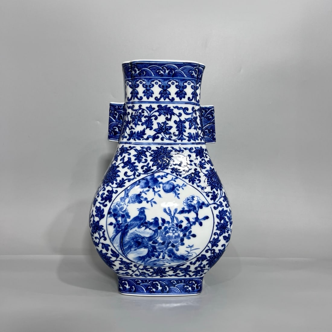A Exquisite Blue and White Flower and Bird Pattern Vase: A Exquisite Blue and White Flower and Bird Pattern Vase,Qing Dynasty, China,Qianlong Six-character Mark,Size:12.3inx7.9in 