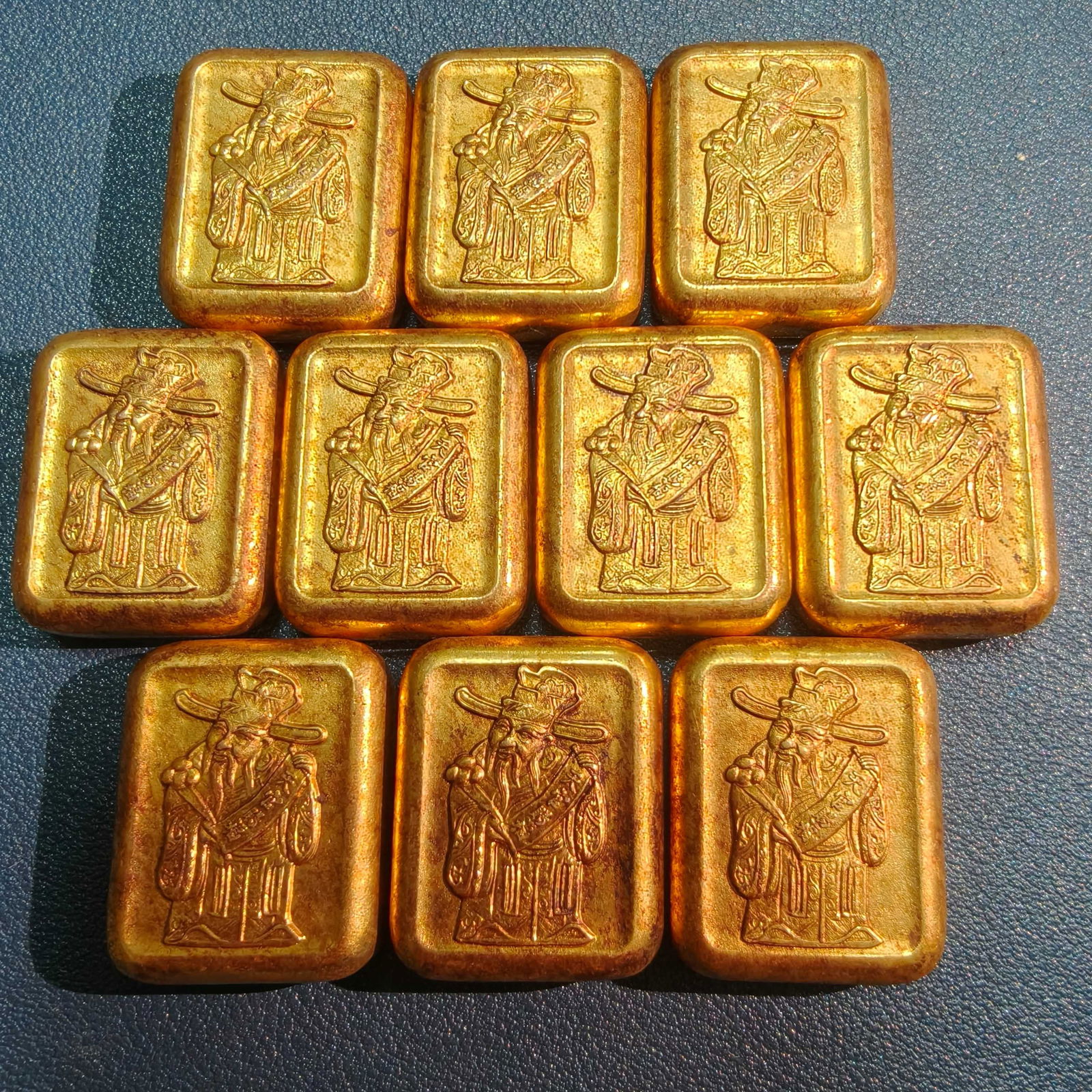 A Set of Exquisite Bronze Gilt Human Pattern Gold Ingot: A Set of Exquisite Bronze Gilt Human Pattern Gold Ingot,Qing Dynasty, China,Size:1.1inx0.9inx0.81,Weight:36.8g 